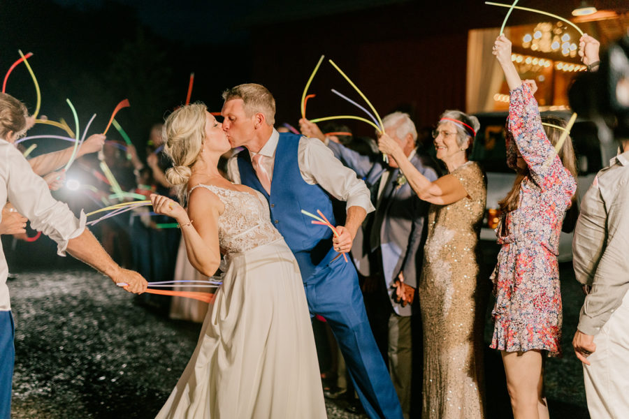 A glow stick exit from their wedding at Red Barn Inn
