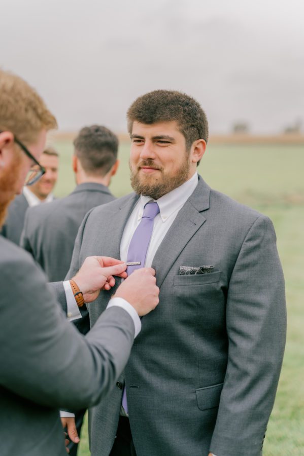 the groom gets ready at Ducar Farms