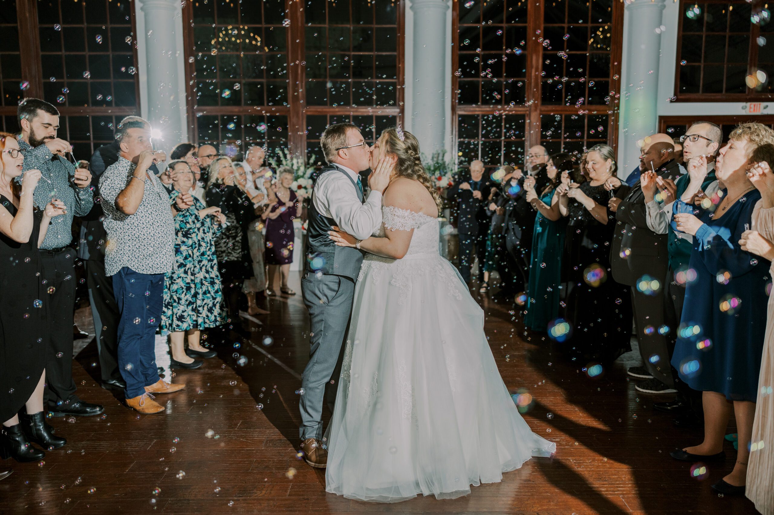 an indoor bubble exit for this rainy wedding day at Raspberry Plain Manor