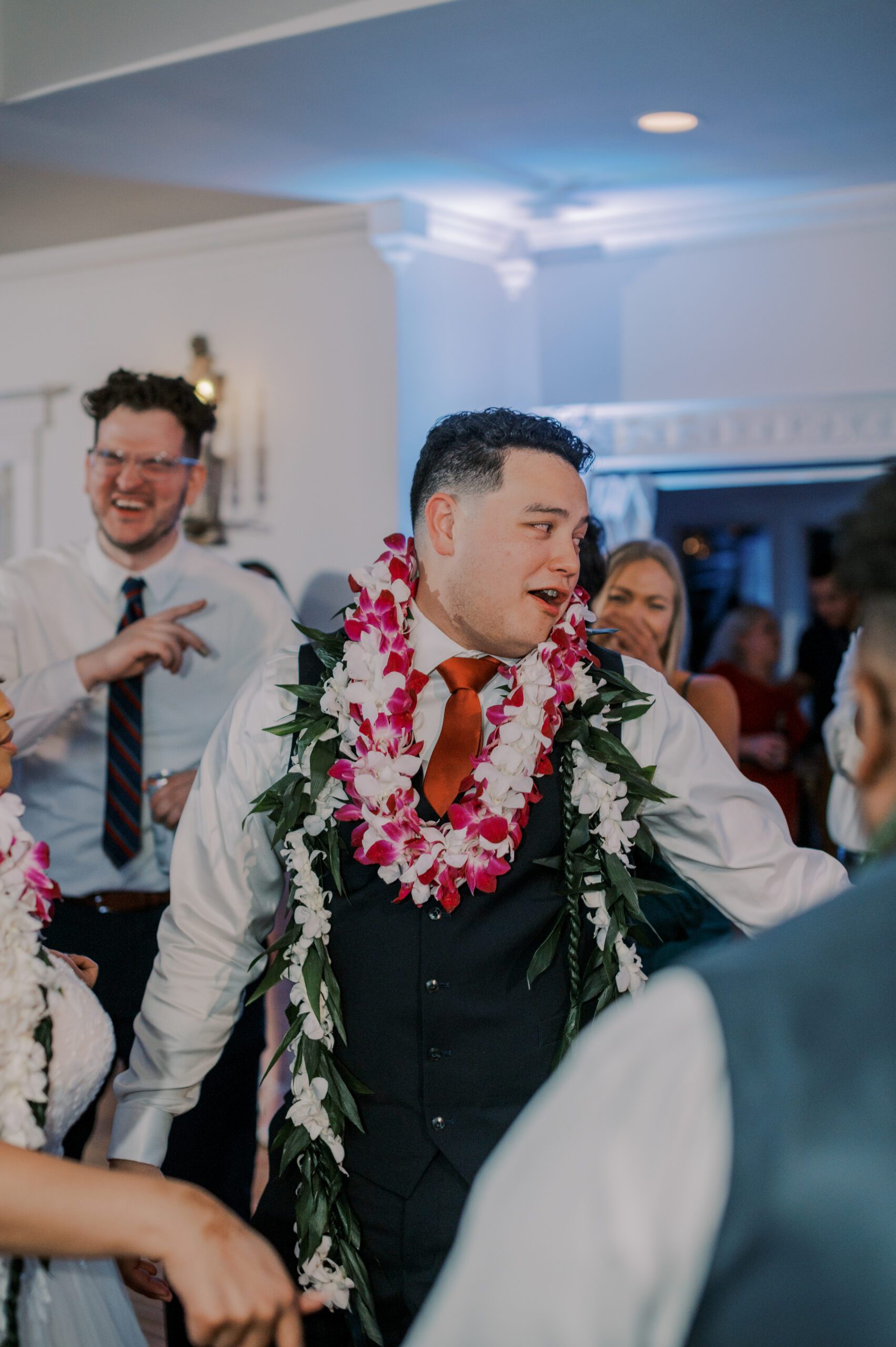 Groom dancing on dance floor at the manor at airmont, wearing multiple leis