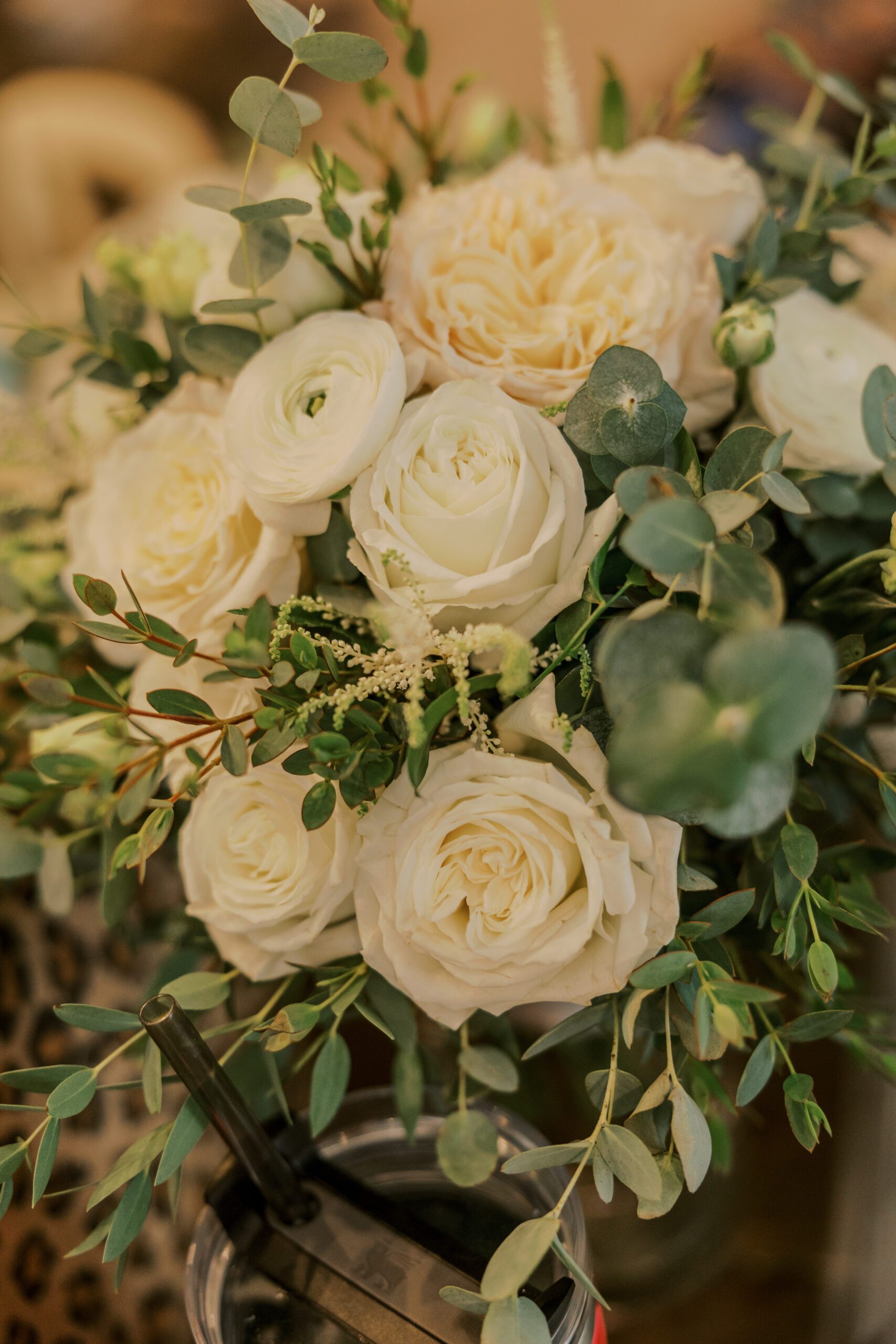 Image of white roses and florals with lots of greenery for the arbor haven fall wedding