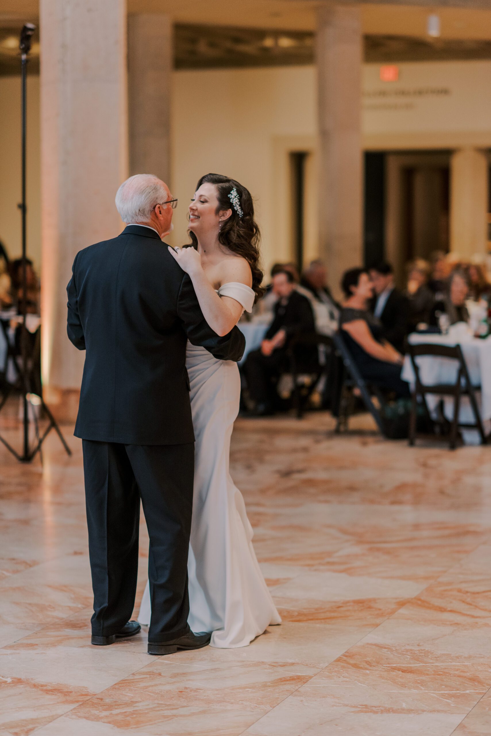 Bride and her father dancing on the pink marble floor at her vmfa fall wedding