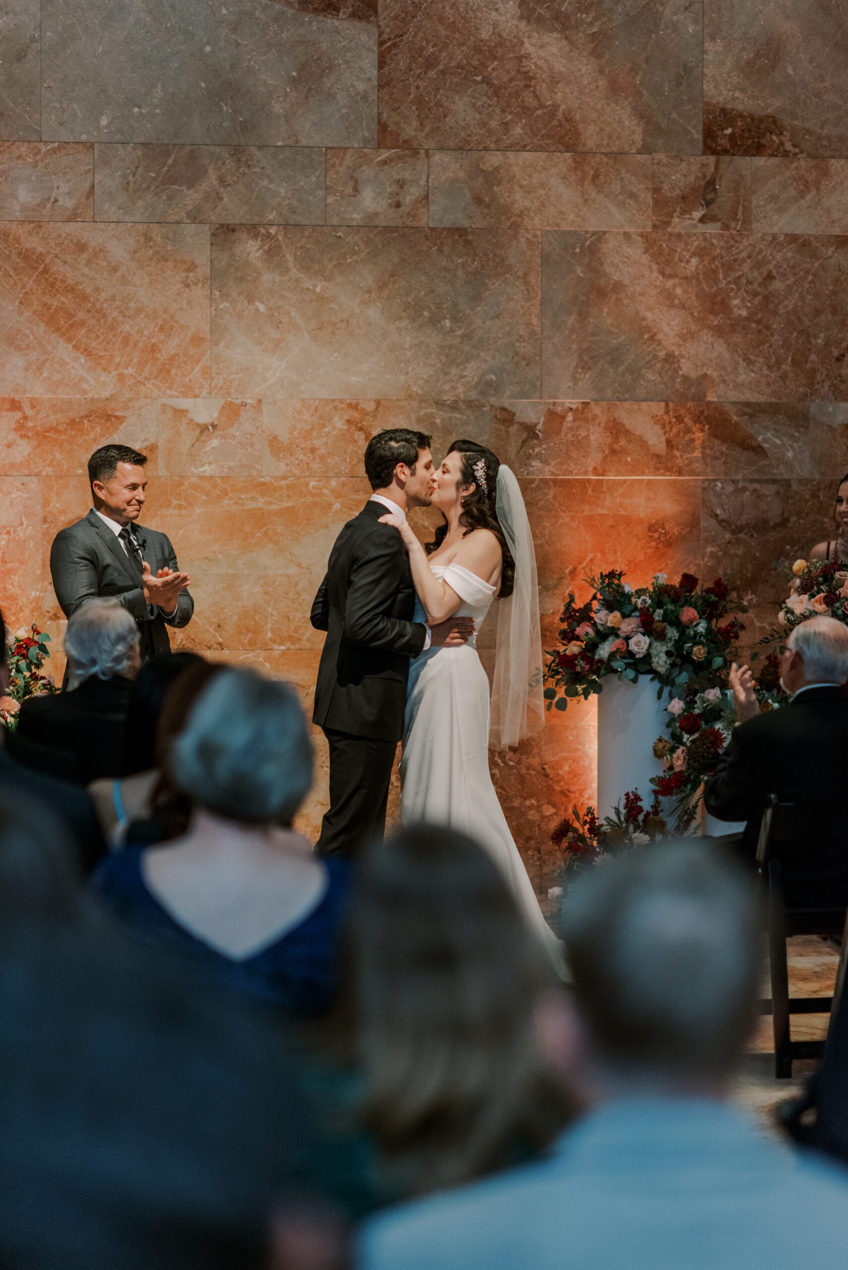 Bride and groom share their first kiss as husband and wife at. their vmfa fall wedding
