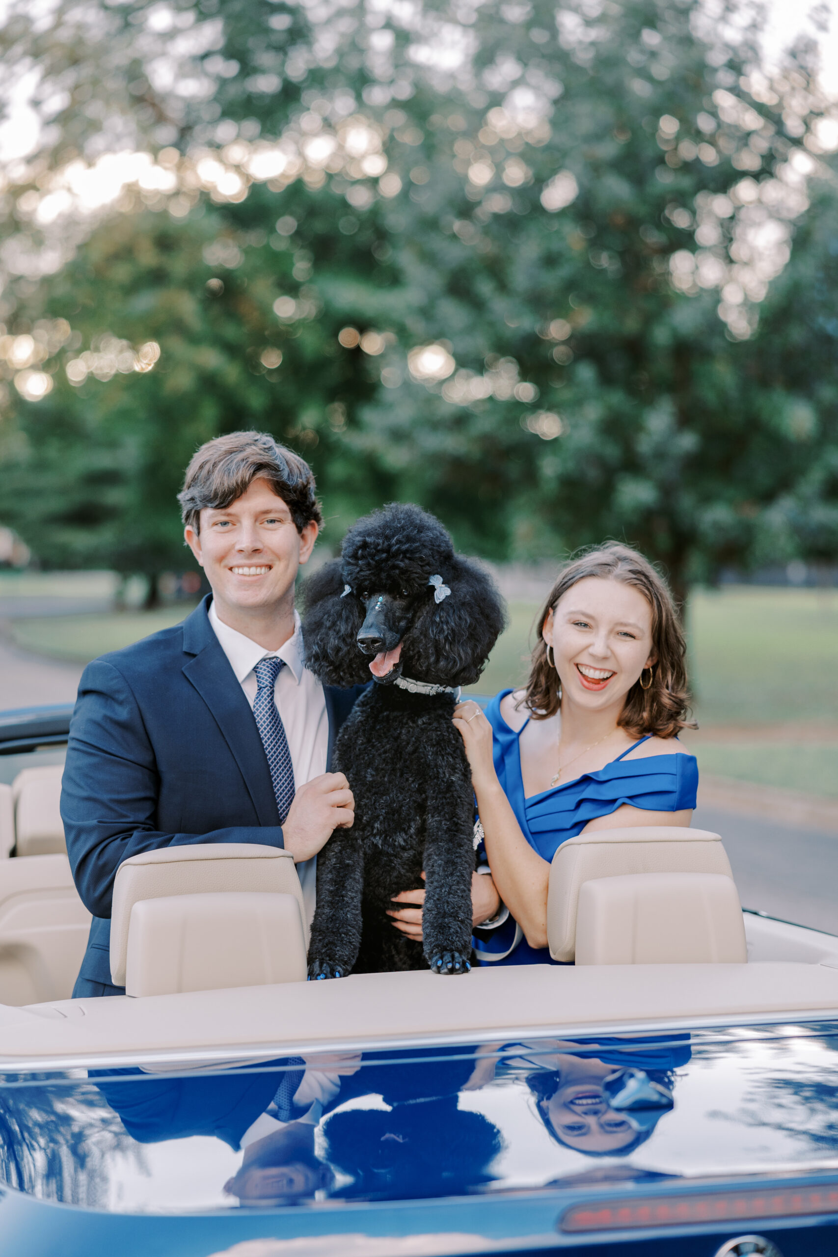 byrd park engagement session, the bride and groom pose with their dog and car