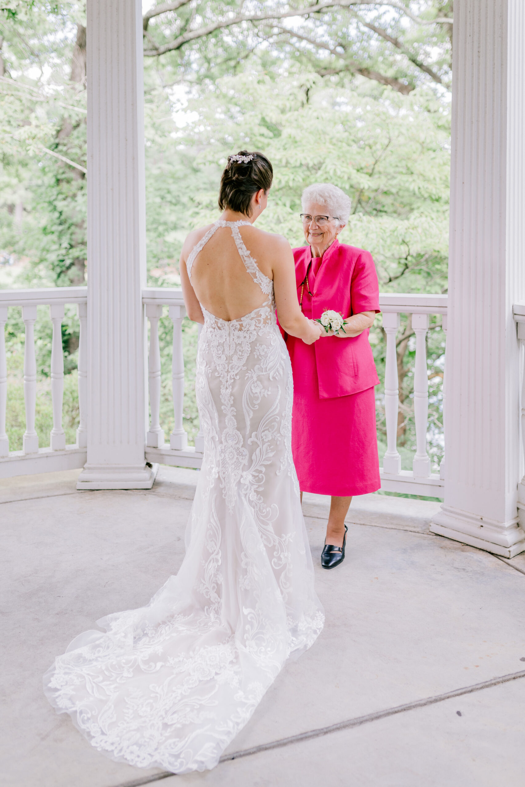 bride and grandma share a first look moment during their lewis ginter botanical garden wedding
