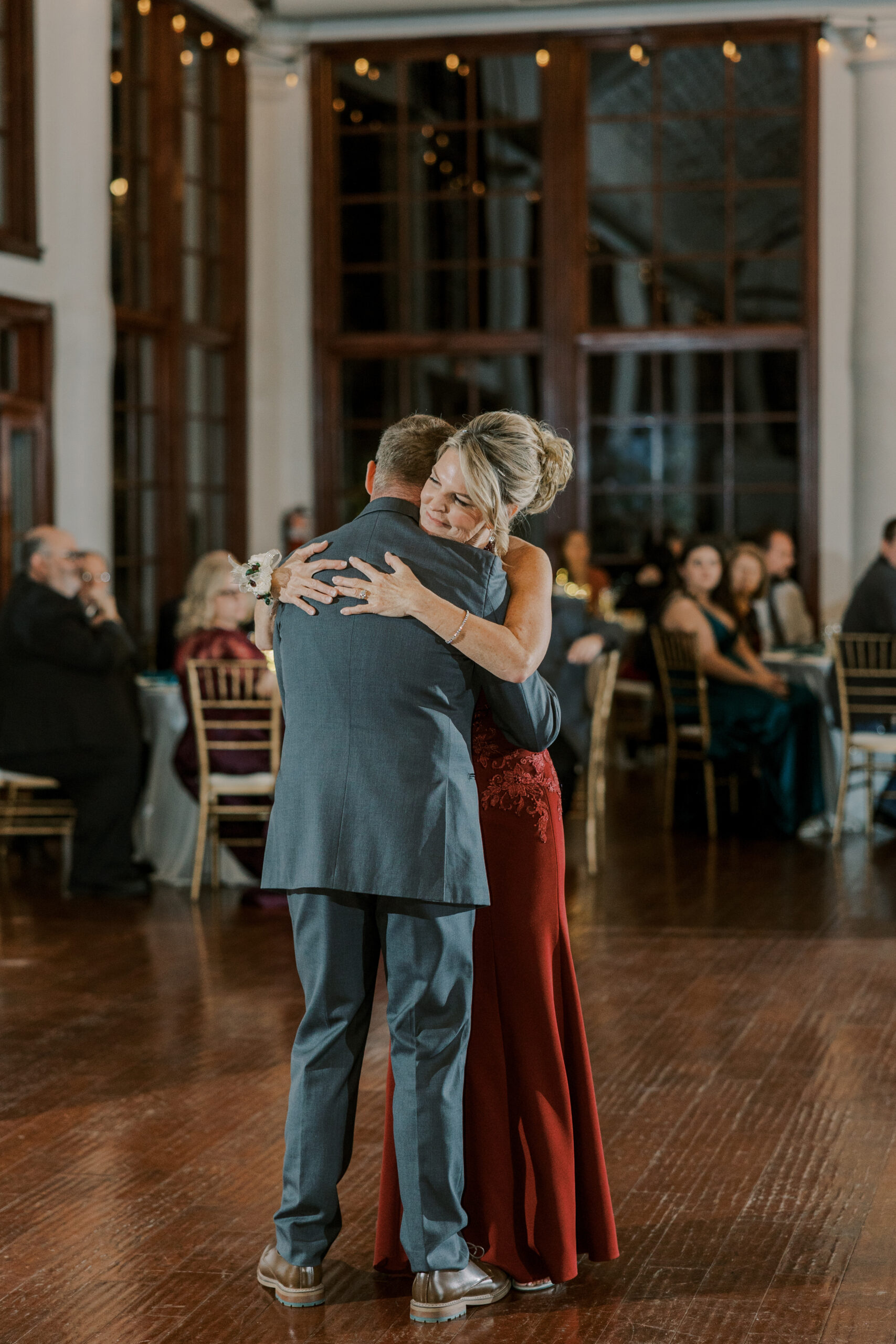 the groom and his mom share a special dance