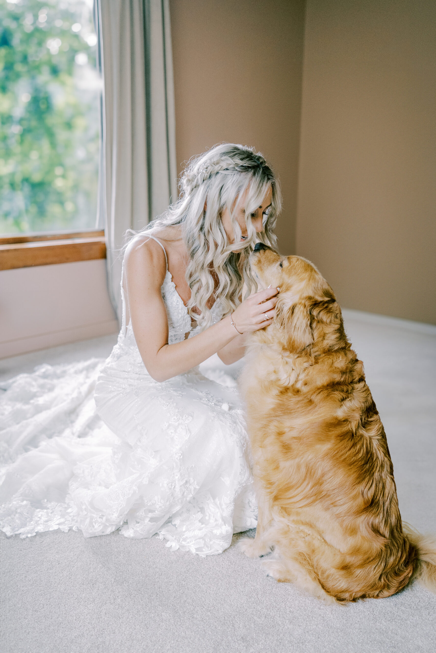 Bride and her dog during getting ready time at her wedding.