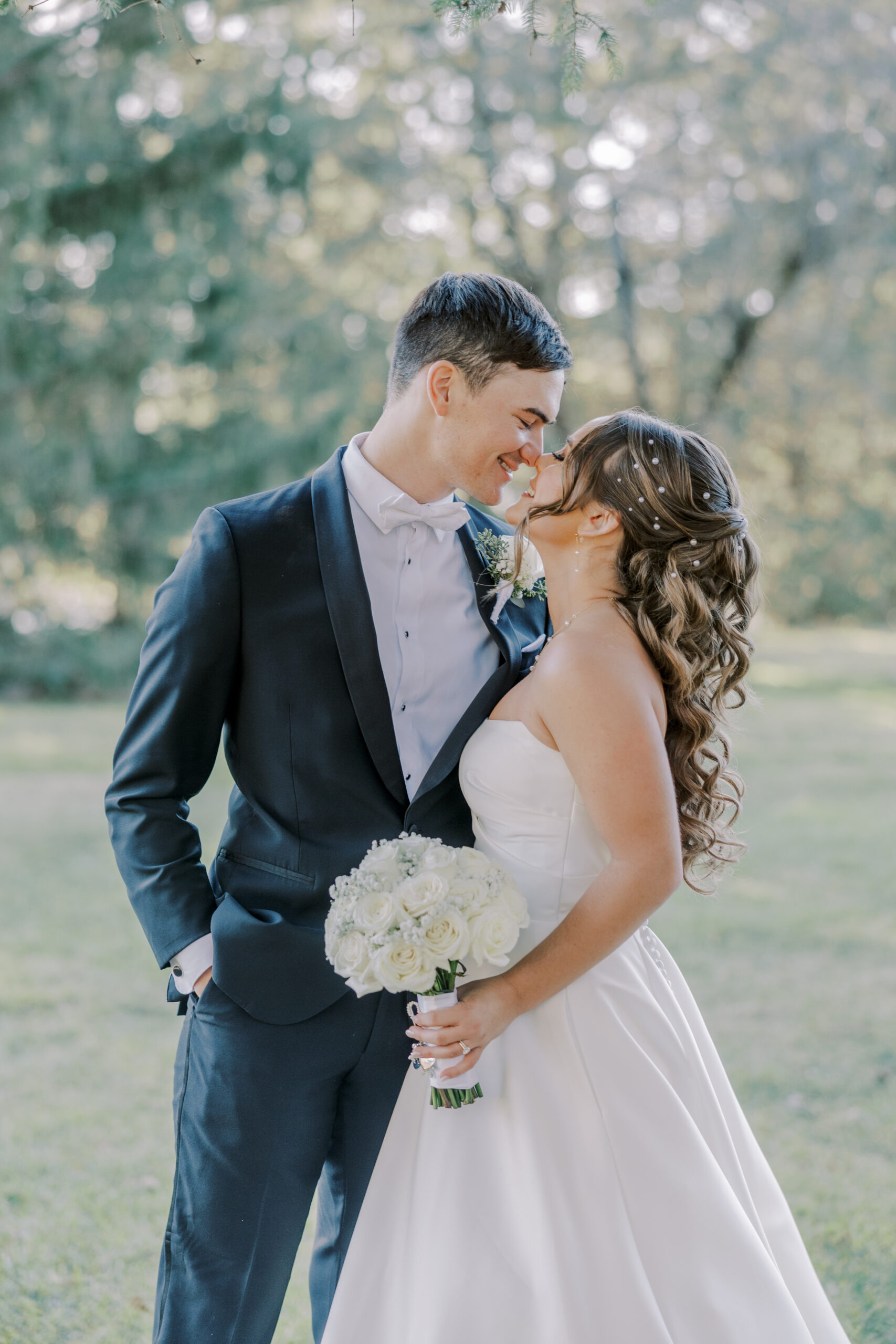 bride and groom nuzzle noses at their Perona Farms wedding