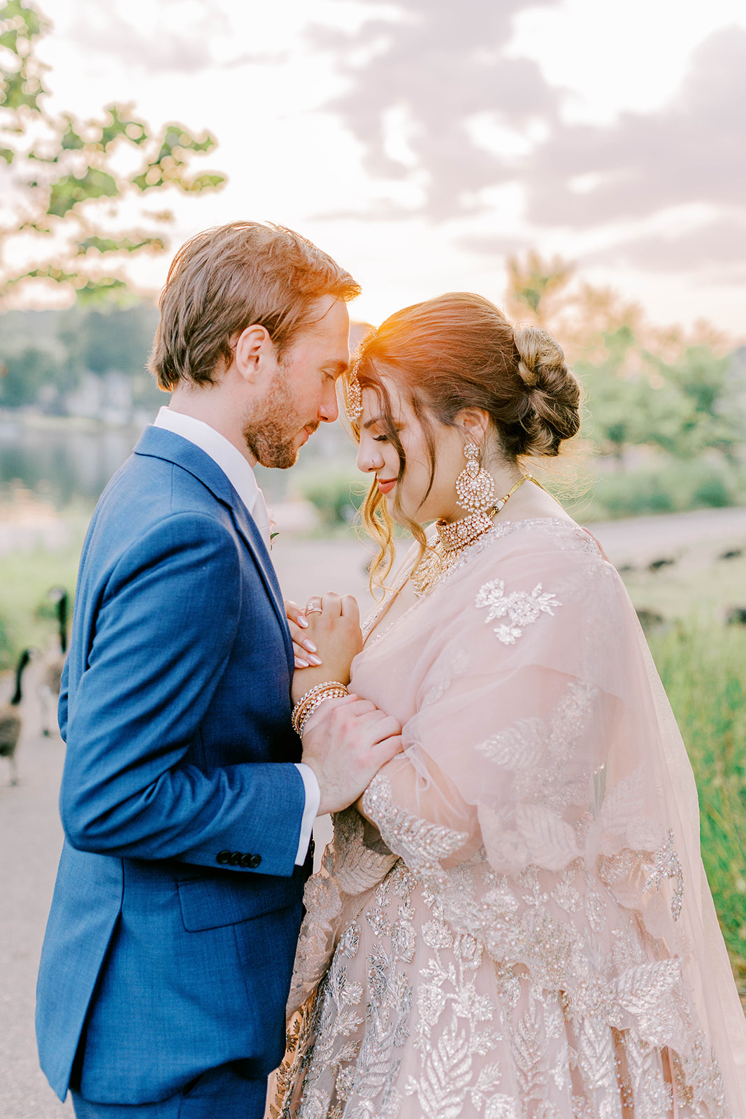 At their Riverview at Occoquan wedding, the bride and groom snuggle close.
