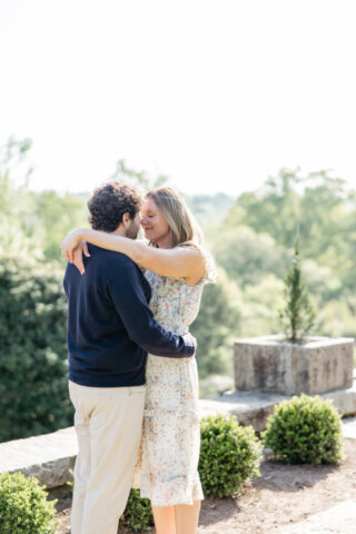 Man and woman embracing one another at maymont park
