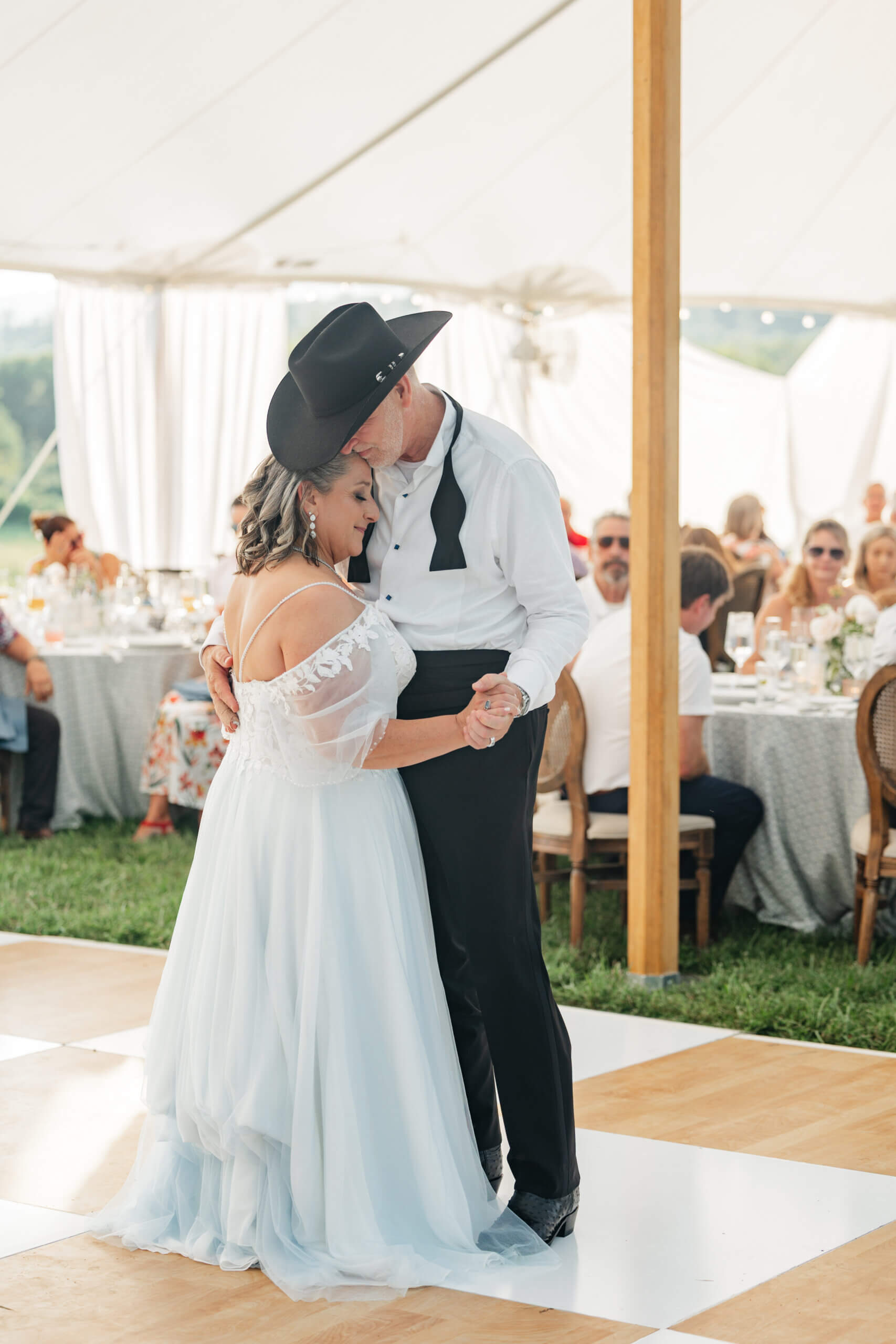 Private Residence Summer Wedding 30 Bride and groom slow dancing for their first dance as husband and wife