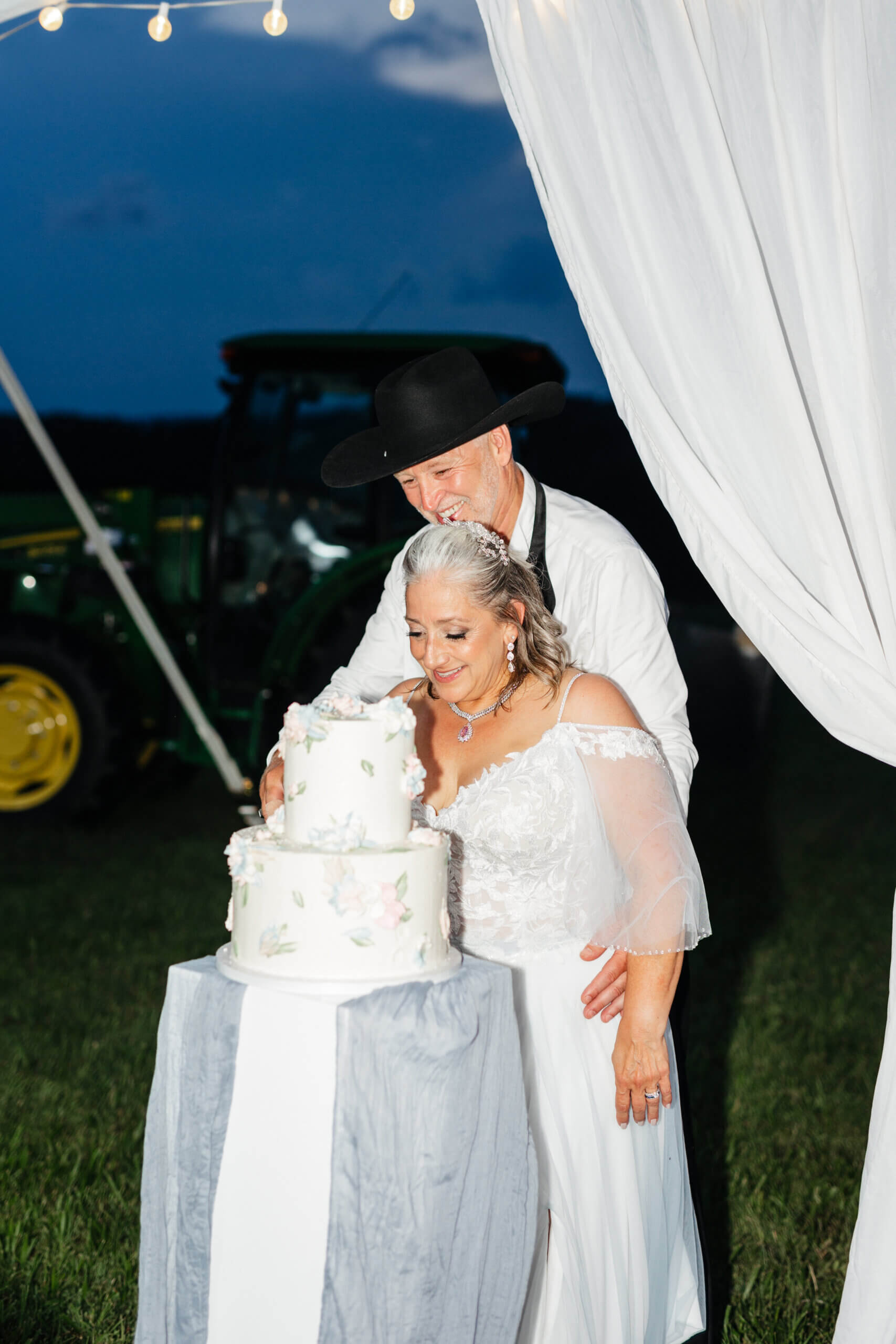 Private Residence Summer Wedding 41 Bride and groom cut into their wedding cake
