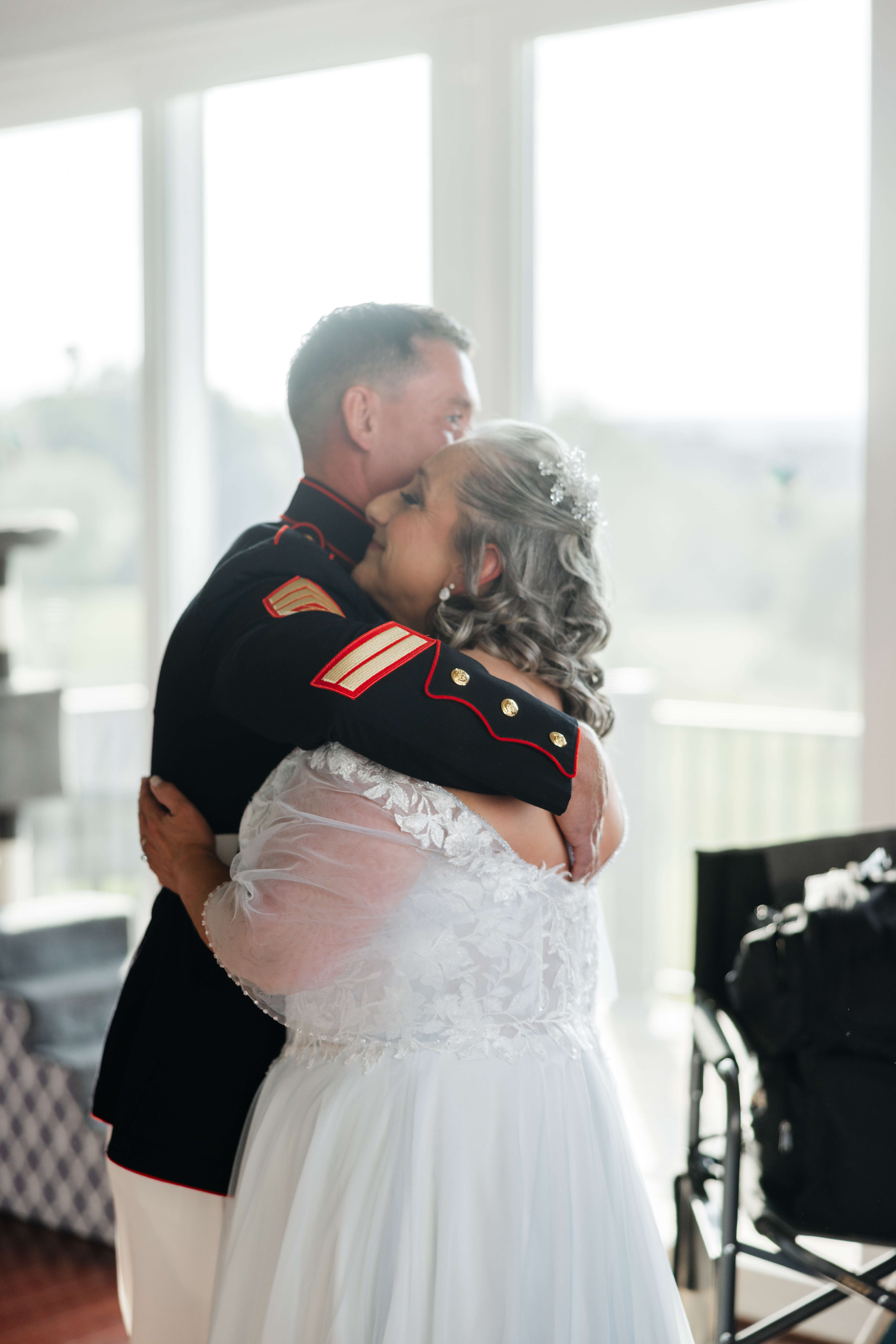 Private Residence Summer Wedding 10 Bride in her wedding dress hugging her adult son