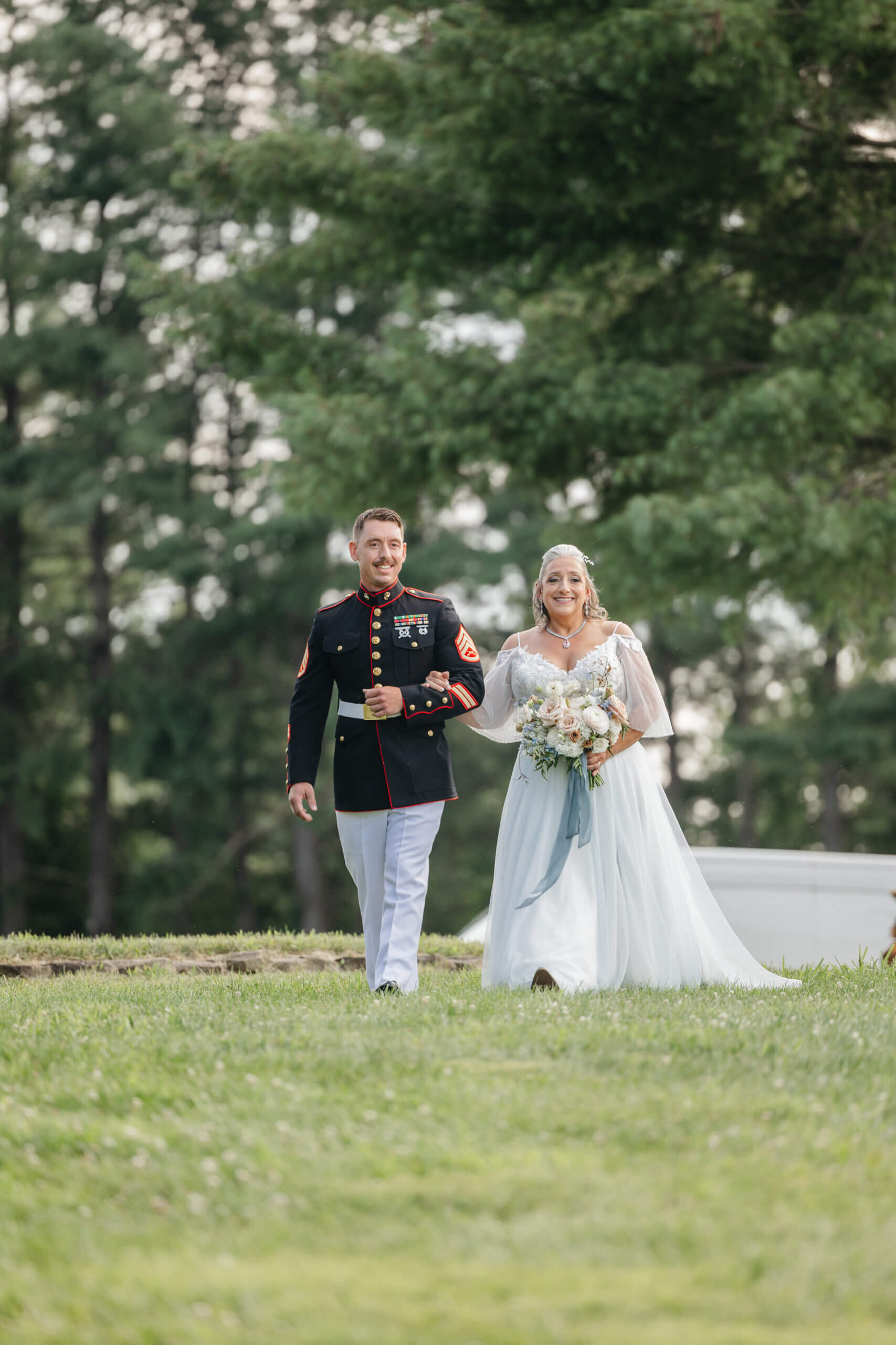 Private Residence Summer Wedding 13 Bride and her son (in military dressings), walk arm in arm towards the wedding ceremony