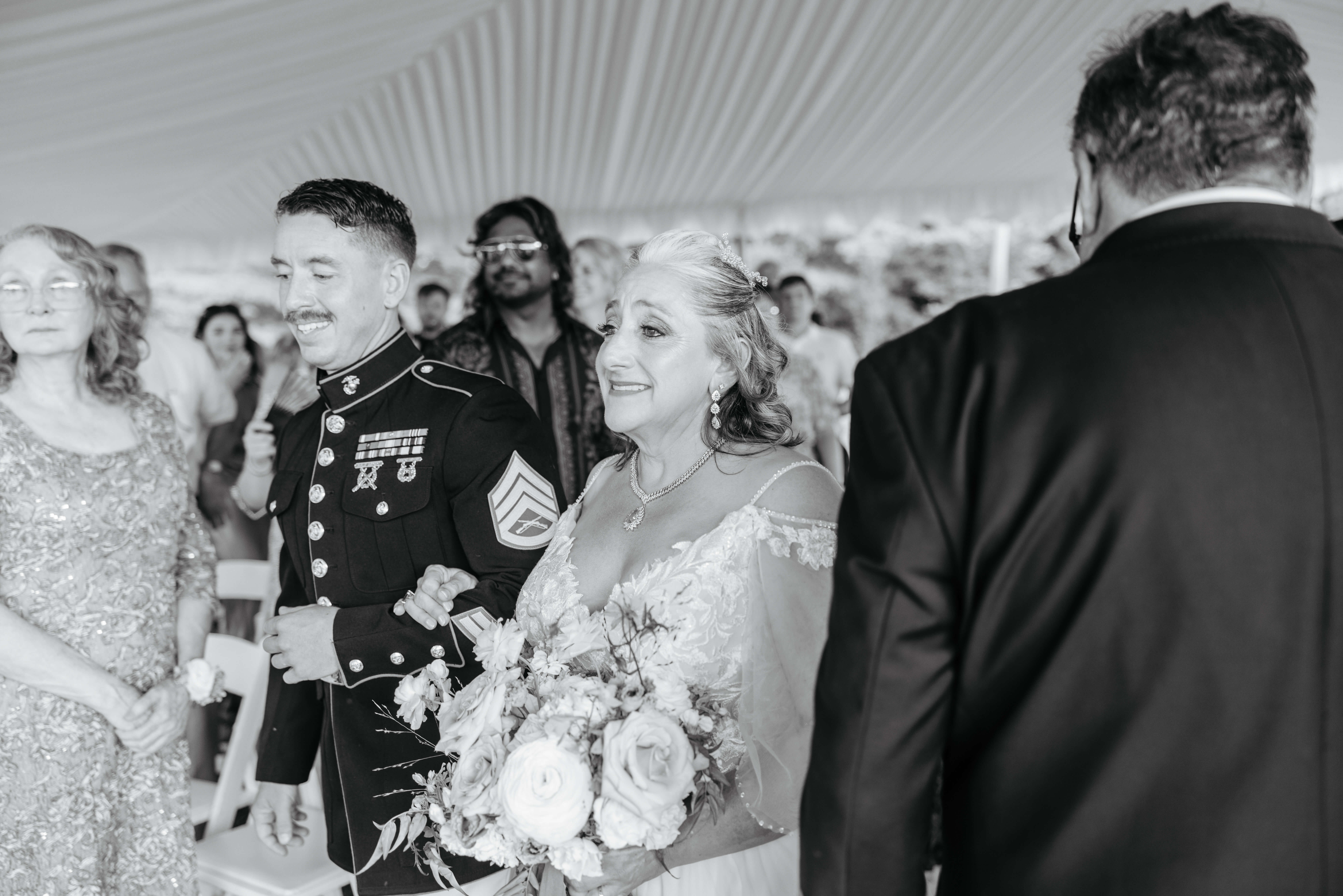 Private Residence Summer Wedding 14 Black and white photo of bride approaching altar with an emotional smile on her face