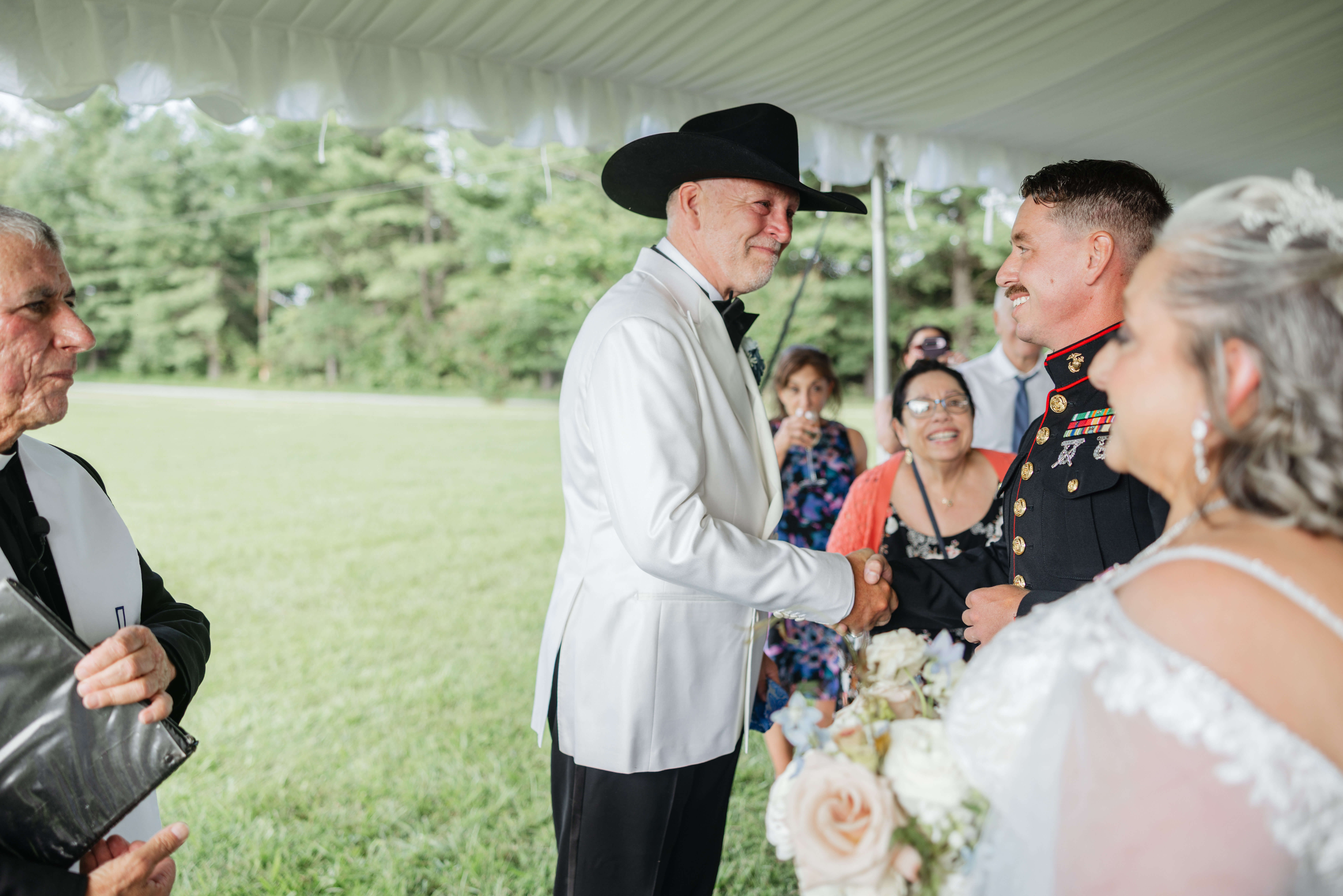Private Residence Summer Wedding 15 Groom shakes hand with bride's son