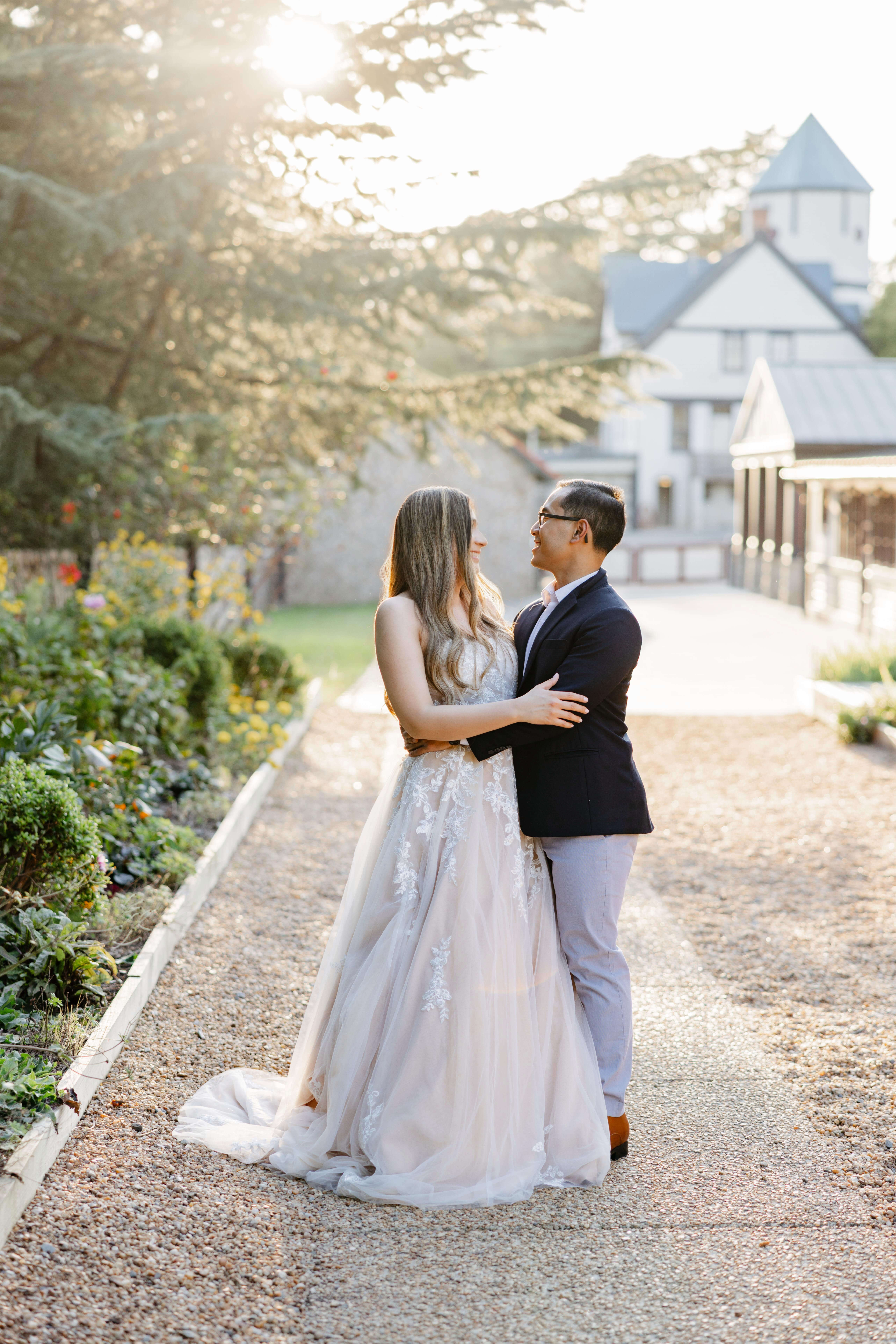 Maymont Park Engagement Summer Photography 14 Engaged couple with their arms wrapped around one another smiling at each other at maymont park