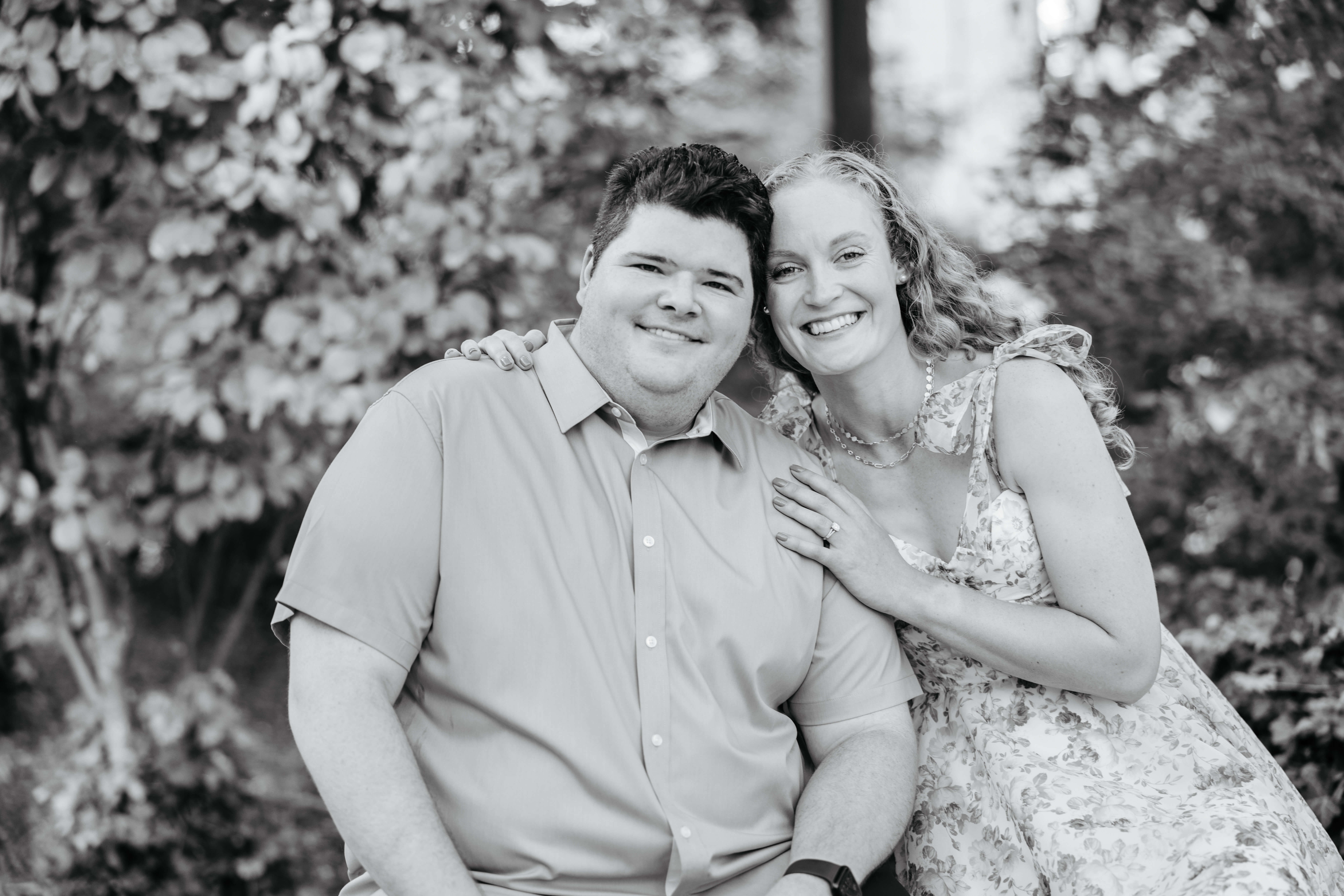 Shockhoe Bottom Fall Engagement Photography 14 Woman leaning in to touch heads with her fiance as she puts her hands on his shoulders, both smiling at camera