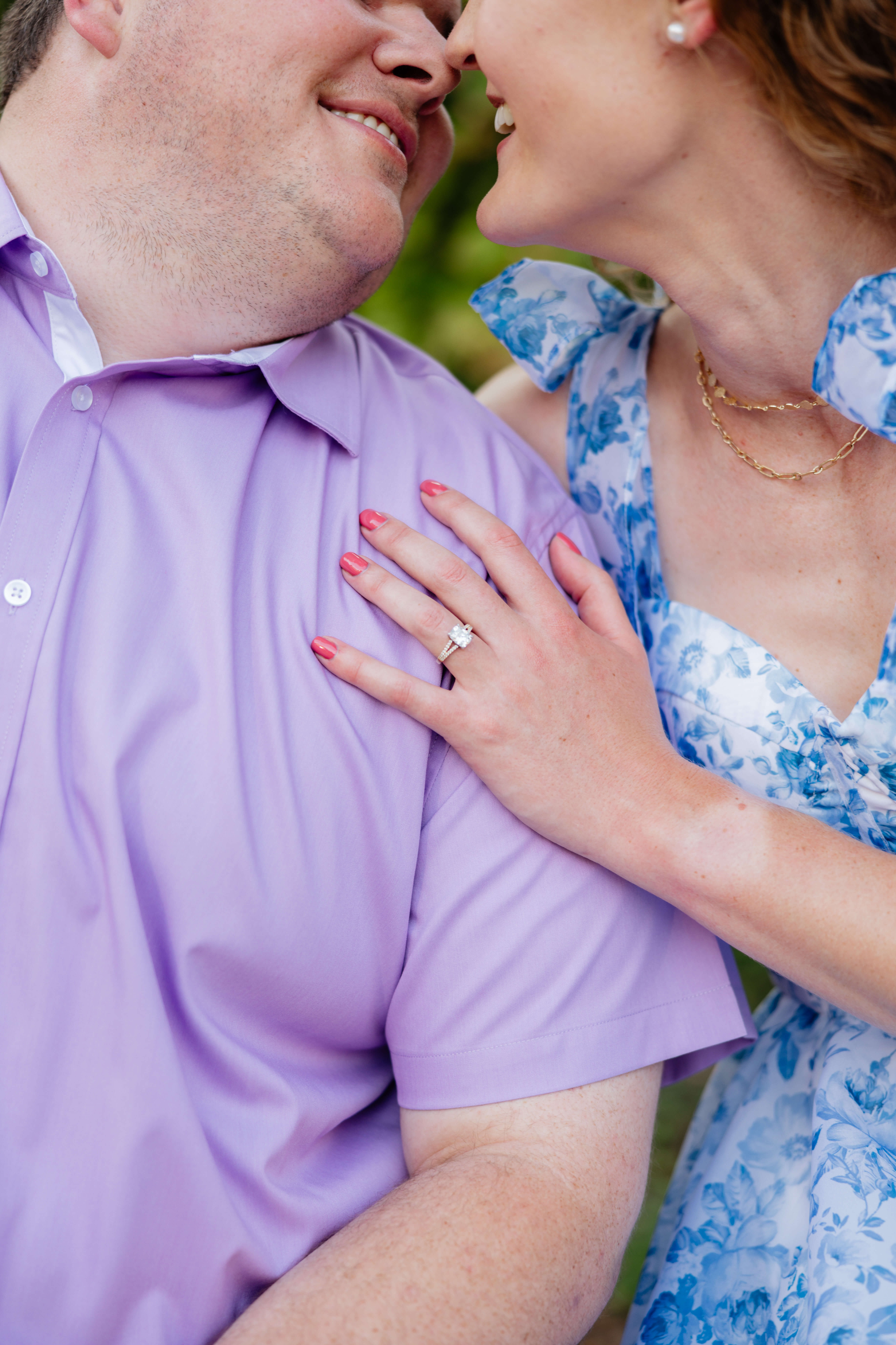 Shockhoe Bottom Fall Engagement Photography 15 Man and woman leaning in for kiss as woman's left hand rests on man's shoulder to show off her engagement ring