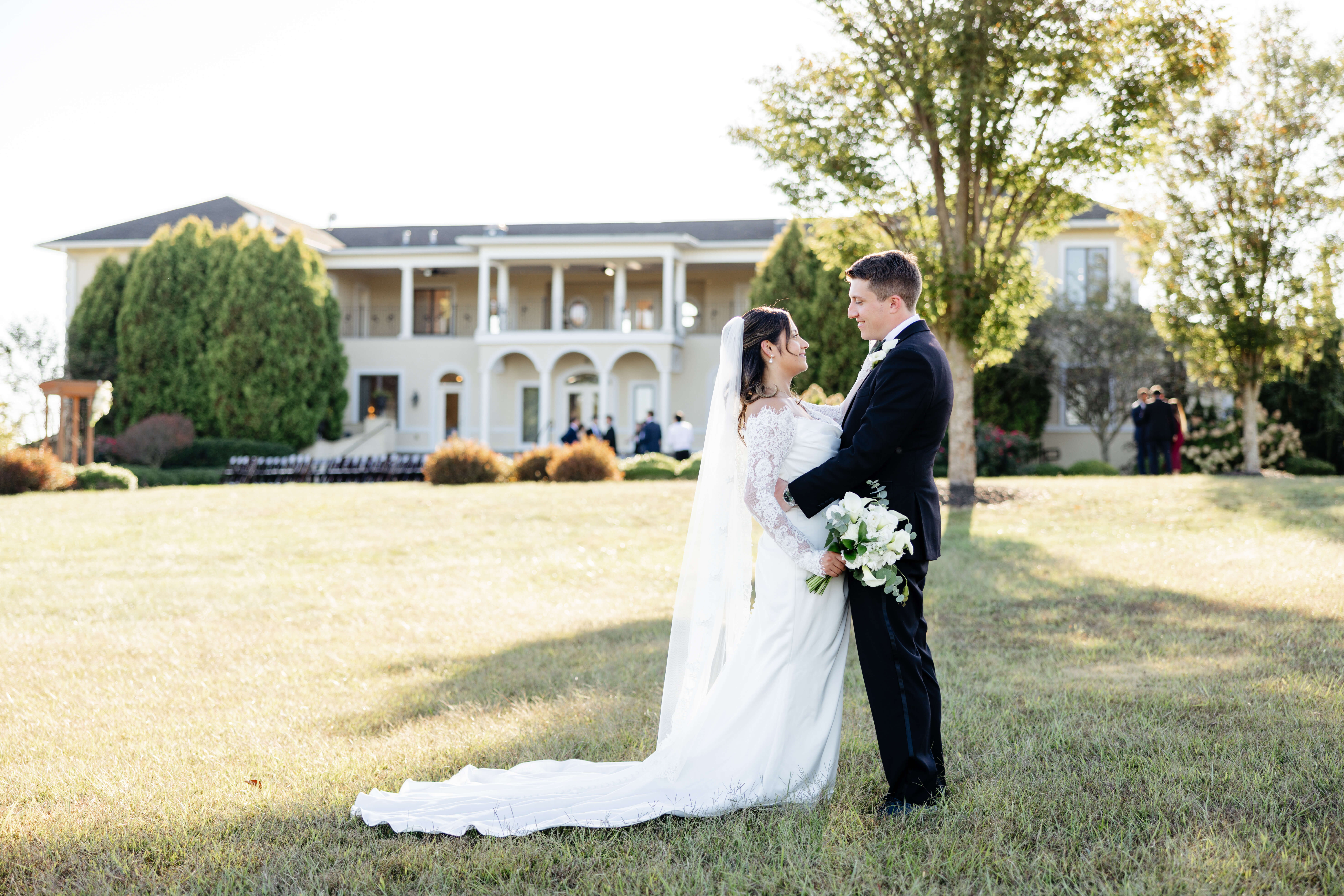 CrossKeys Vineyard Fall Wedding Photography 25 Bride and groom stand facing each other smiling with crosskeys vineyard in background