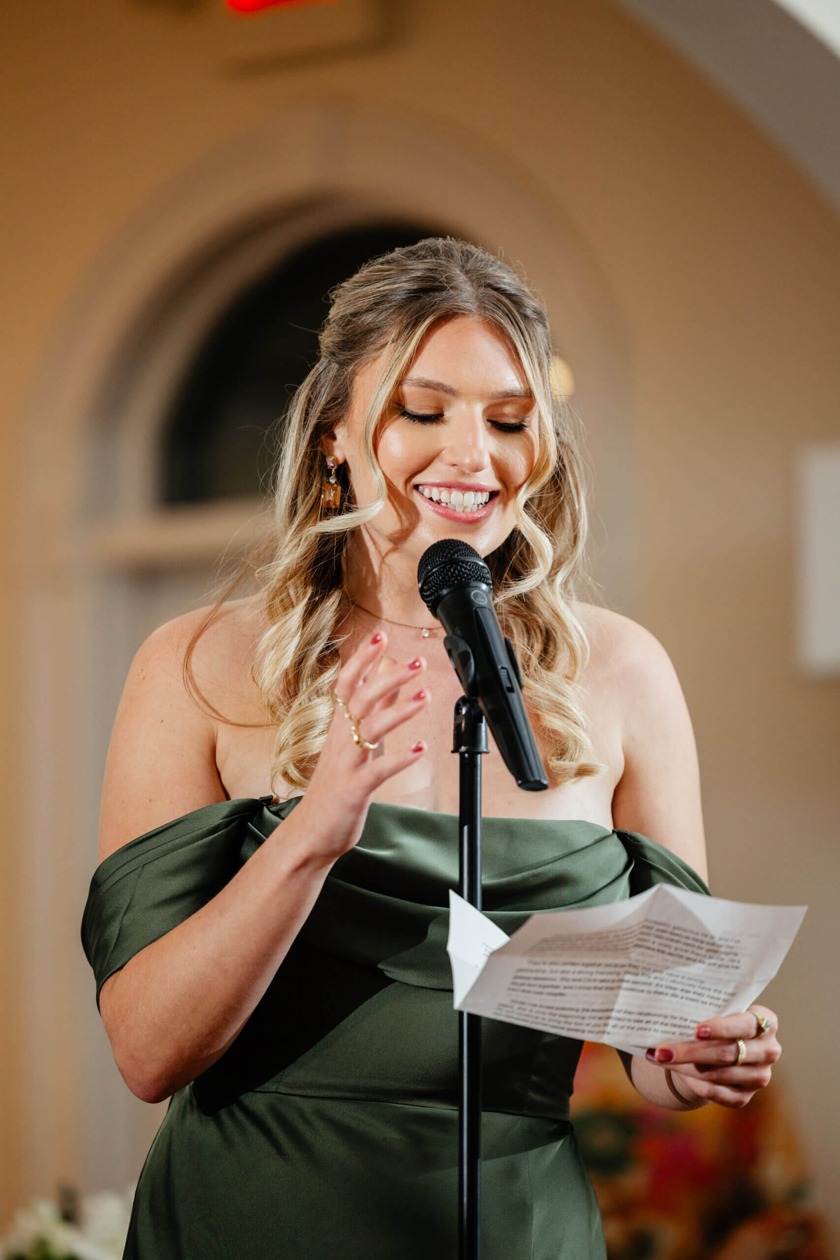 CrossKeys Vineyard Fall Wedding Photography 37 Bridesmaid giving a speech smiling as she holds a piece of paper