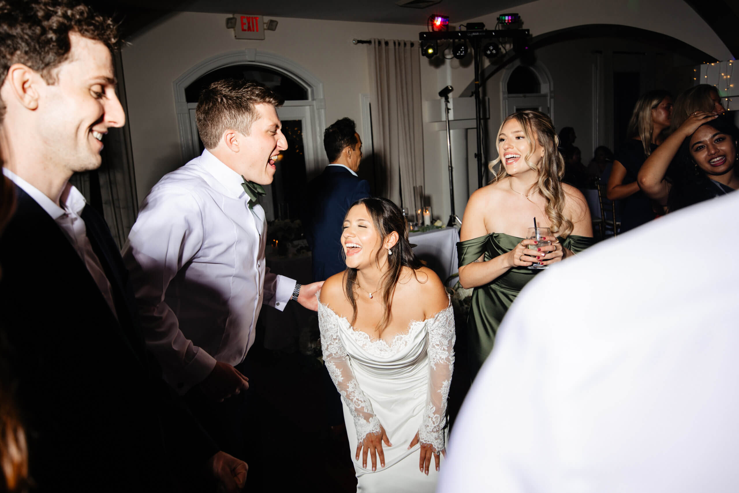 CrossKeys Vineyard Fall Wedding Photography 51 Bride and groom dance and sing on the dance floor along with other guests