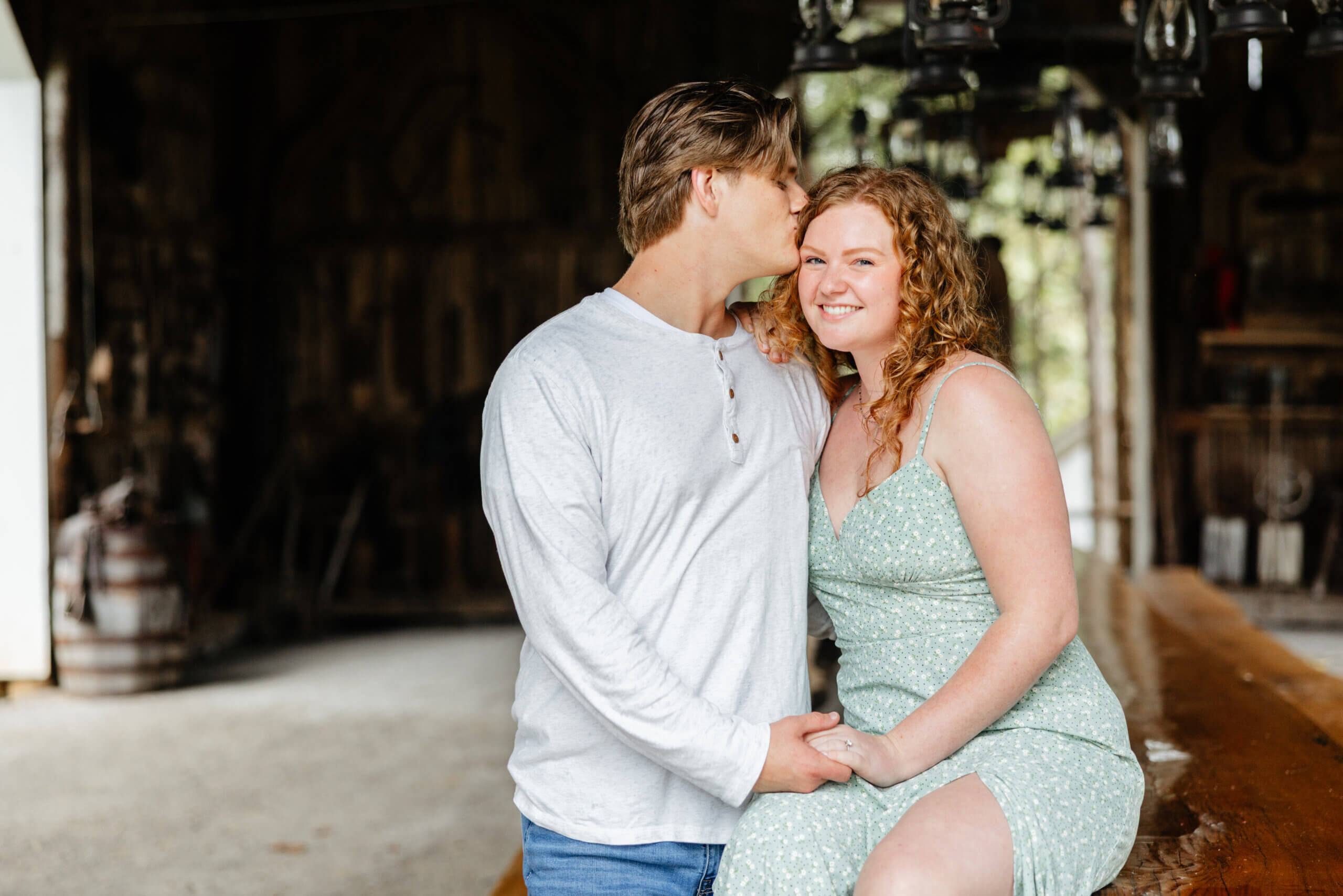 Rassawek Vineyards Fall Engagement Photography 7 Man kissing his fiancee's head as she smiles at camera