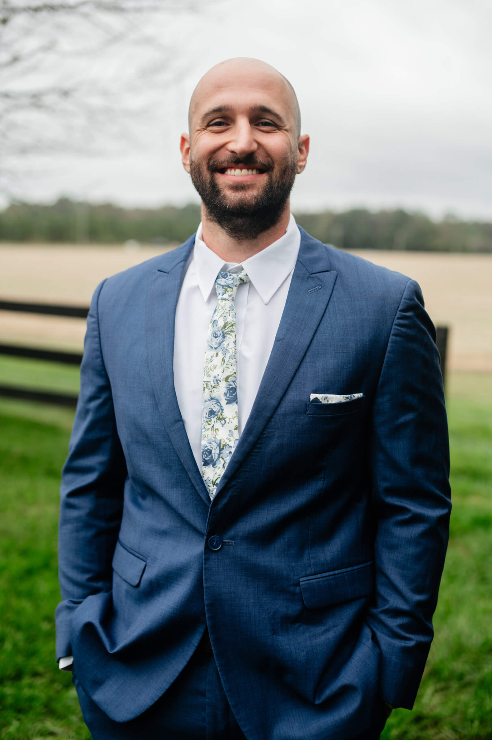 Barns of Kanak October Wedding 8 Solo photo of groom standing outside, hands in pockets, smiling at camera