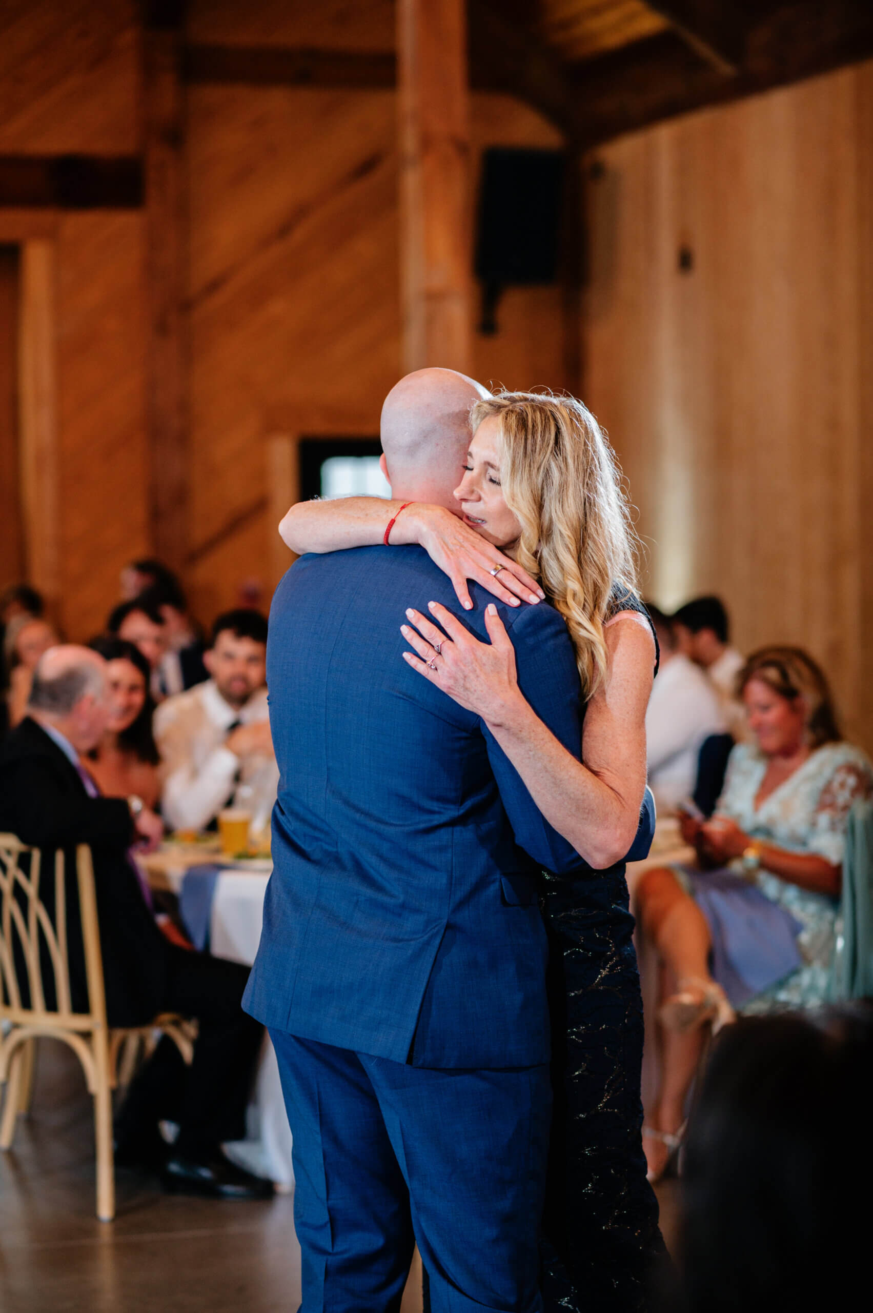 Barns of Kanak October Wedding 41 Groom's mom hugging him as they have the mother son dance
