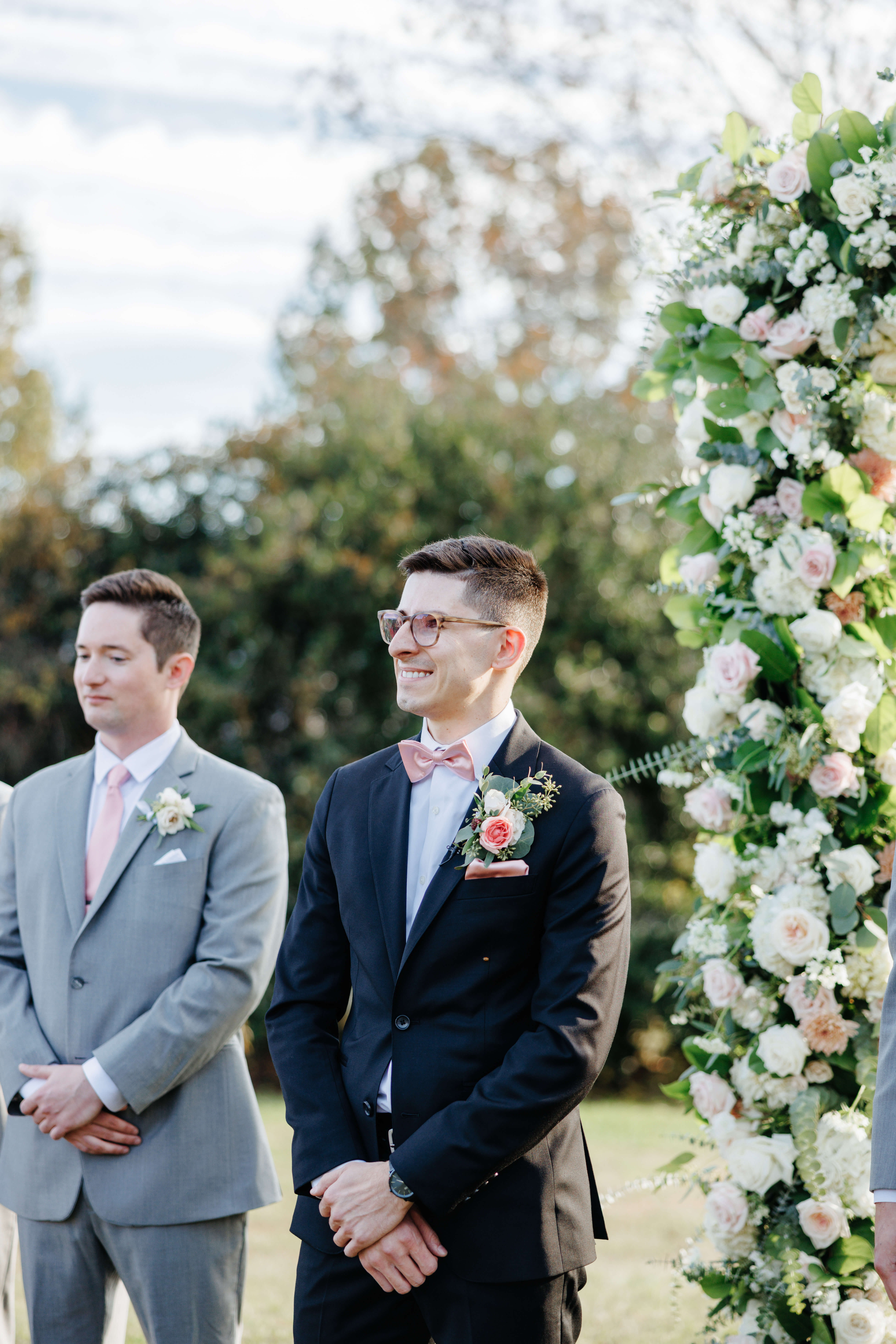 Valley Road Vineyard Fall Wedding 21 Groom smiling as he waits for bride to walk down aisle