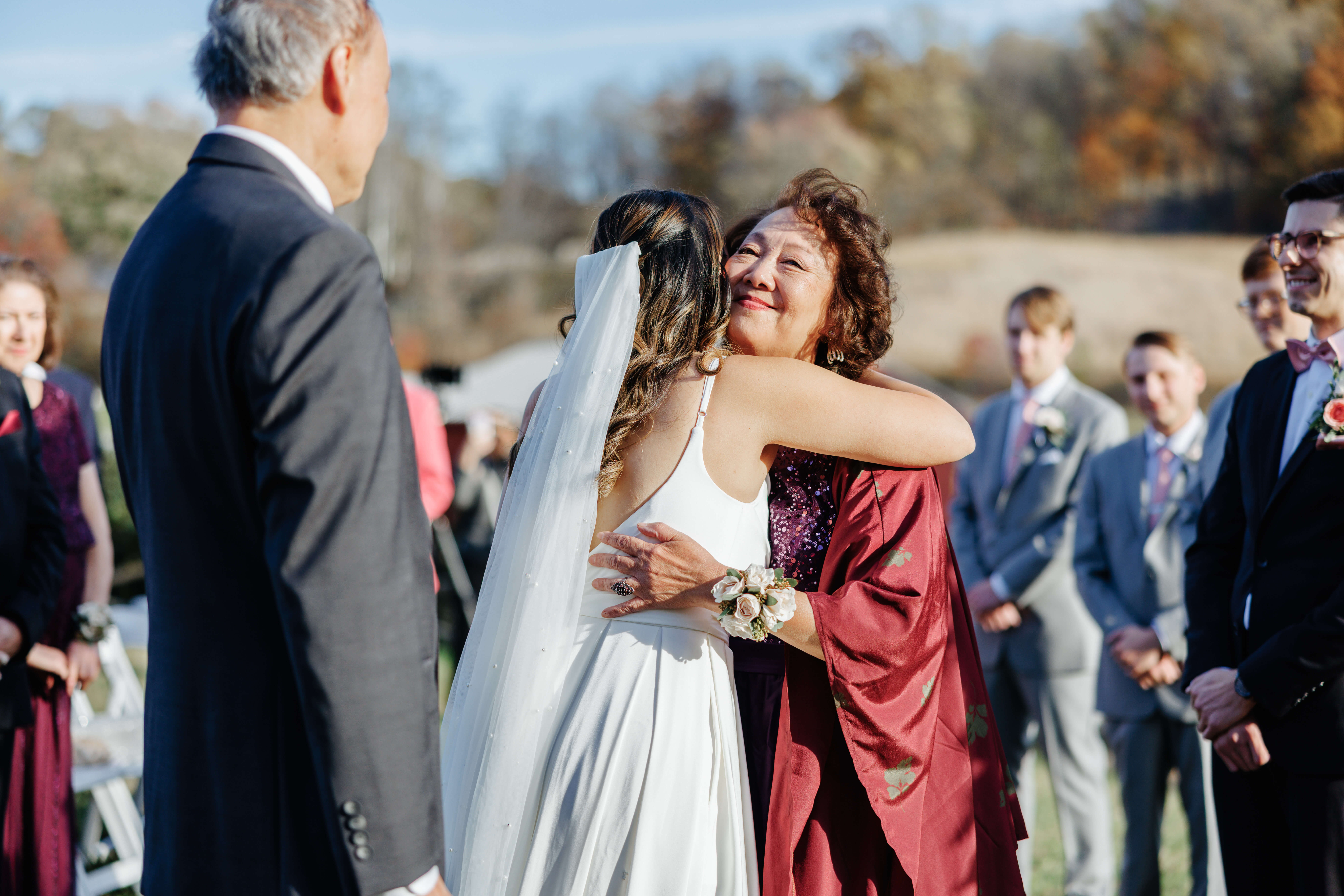Valley Road Vineyard Fall Wedding 23 Bride and her mom share a hug before the ceremony begins