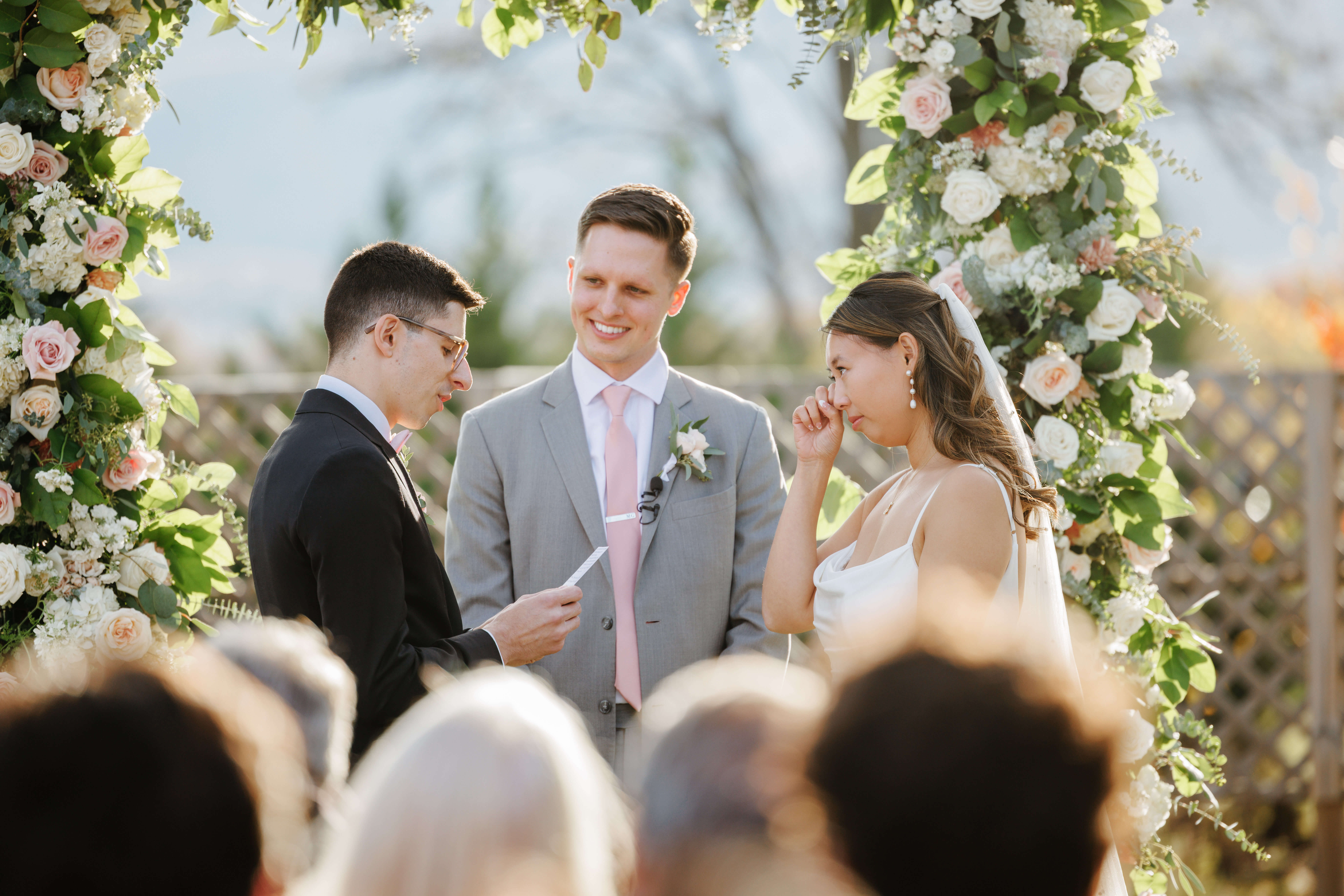 Valley Road Vineyard Fall Wedding 28 Bride wiping a tear from her eye as groom reads his wedding vows