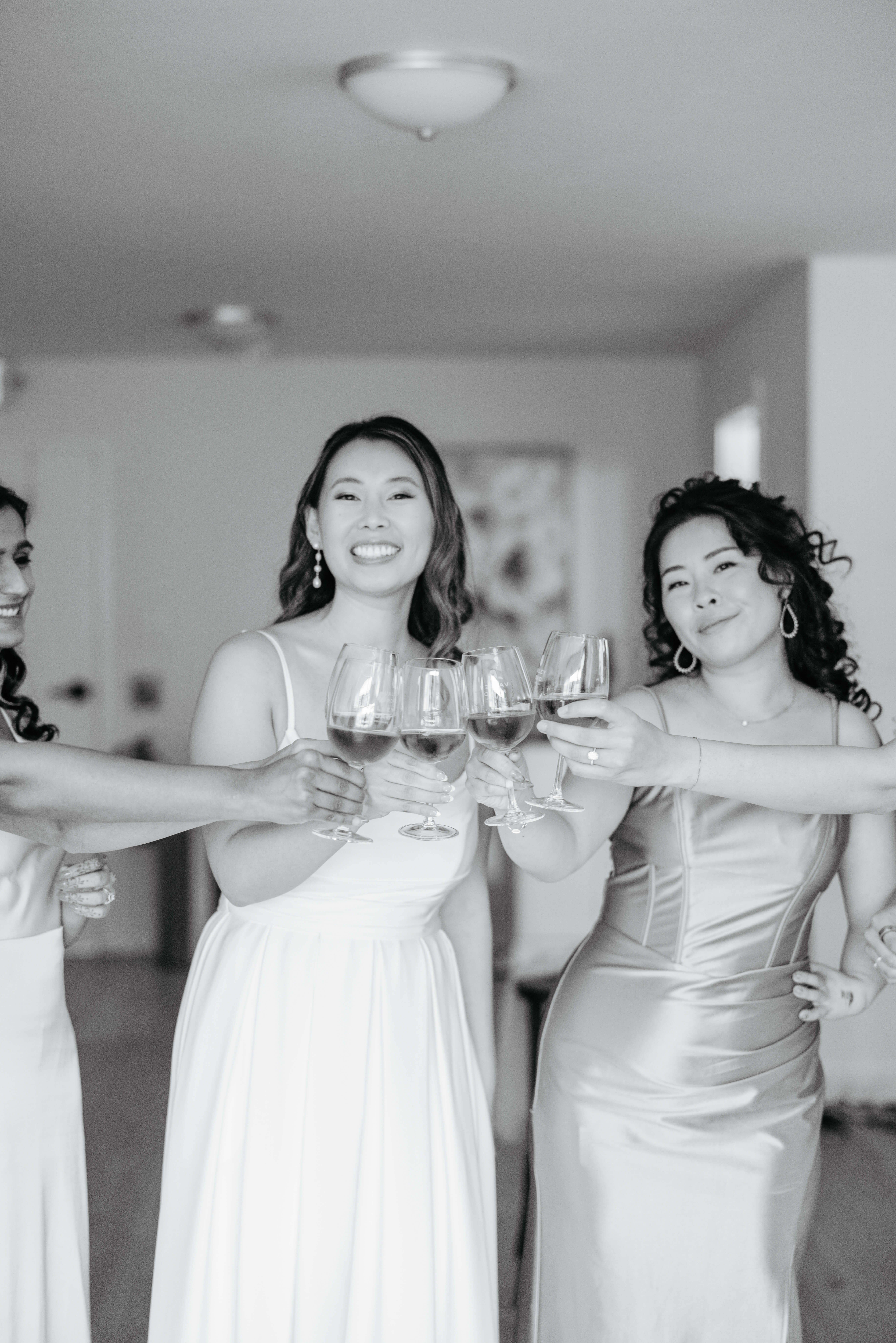 Valley Road Vineyard Fall Wedding 6 Black and white photo of bride and her bridesmaids as they cheer their drinks