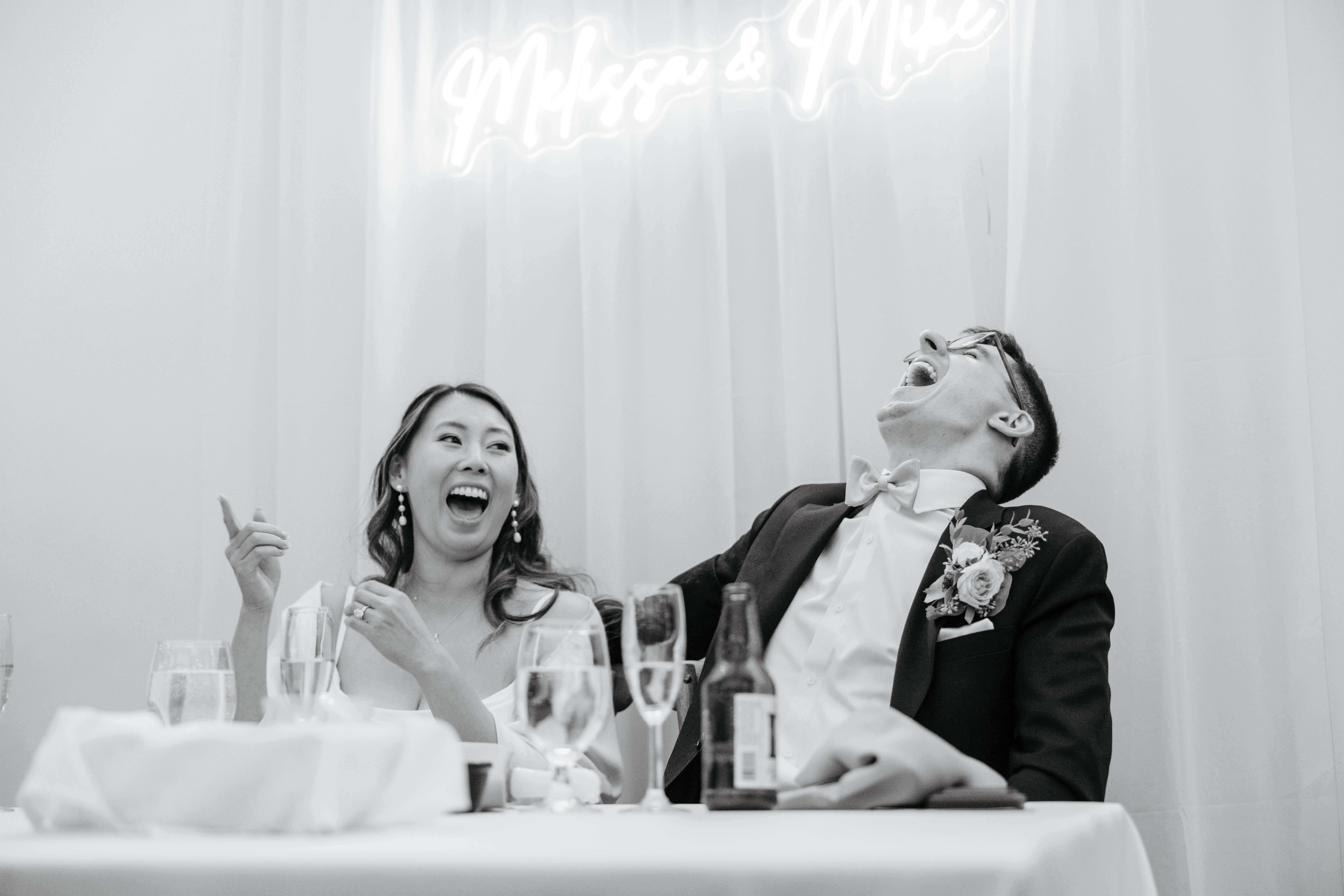 Valley Road Vineyard Fall Wedding 46 Black and white photo of bride and groom laughing hysterically