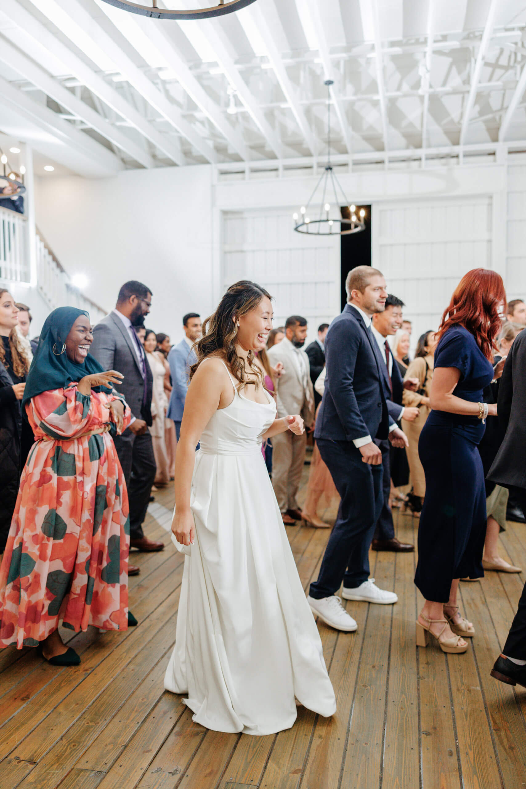 Valley Road Vineyard Fall Wedding 47 Bride dancing on dance floor alongside other guests