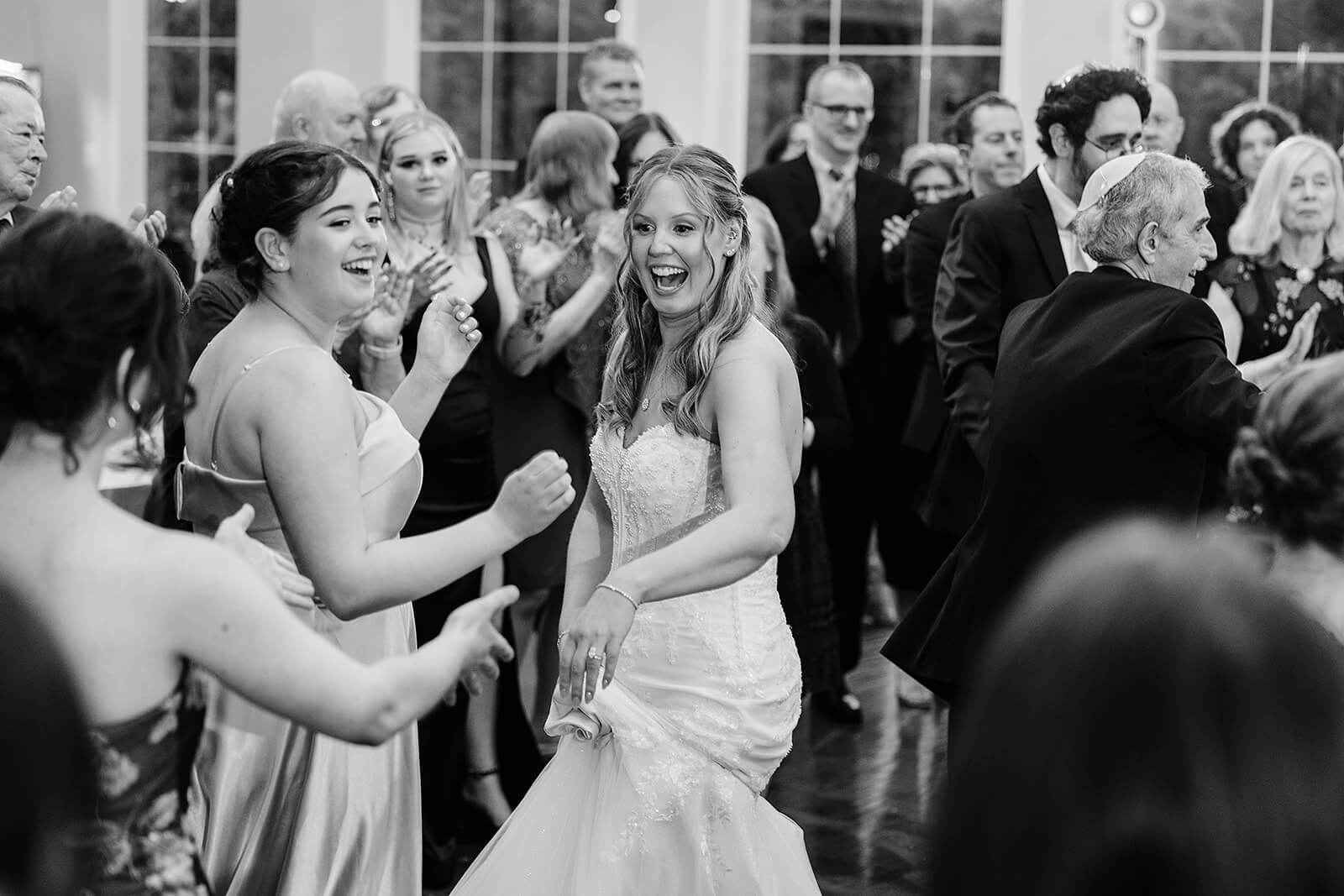 Poplar Springs Manor Spring Wedding Photography 37 black and white photo of bride dancing with guests