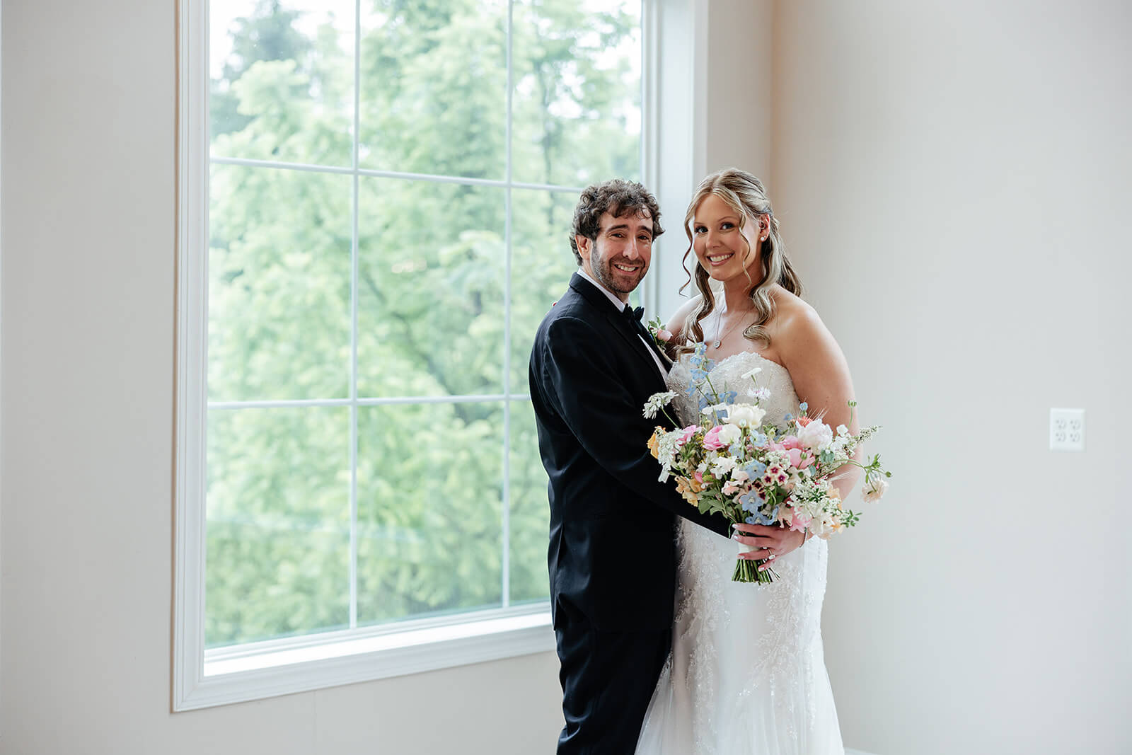 Poplar Springs Manor Spring Wedding Photography 11 portrait of bride and groom standing inside by a large window
