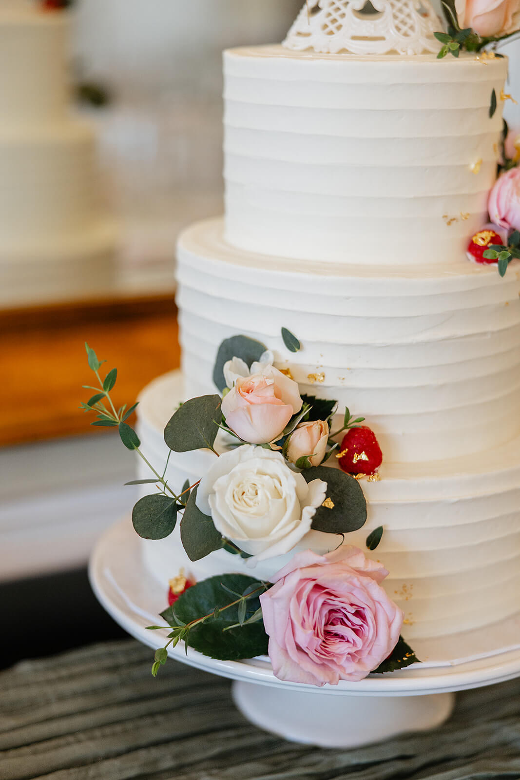 The Mill at Fine Creek Spring Wedding Photography in Powhatan 34 pink, white, and red florals on a tiered white cake