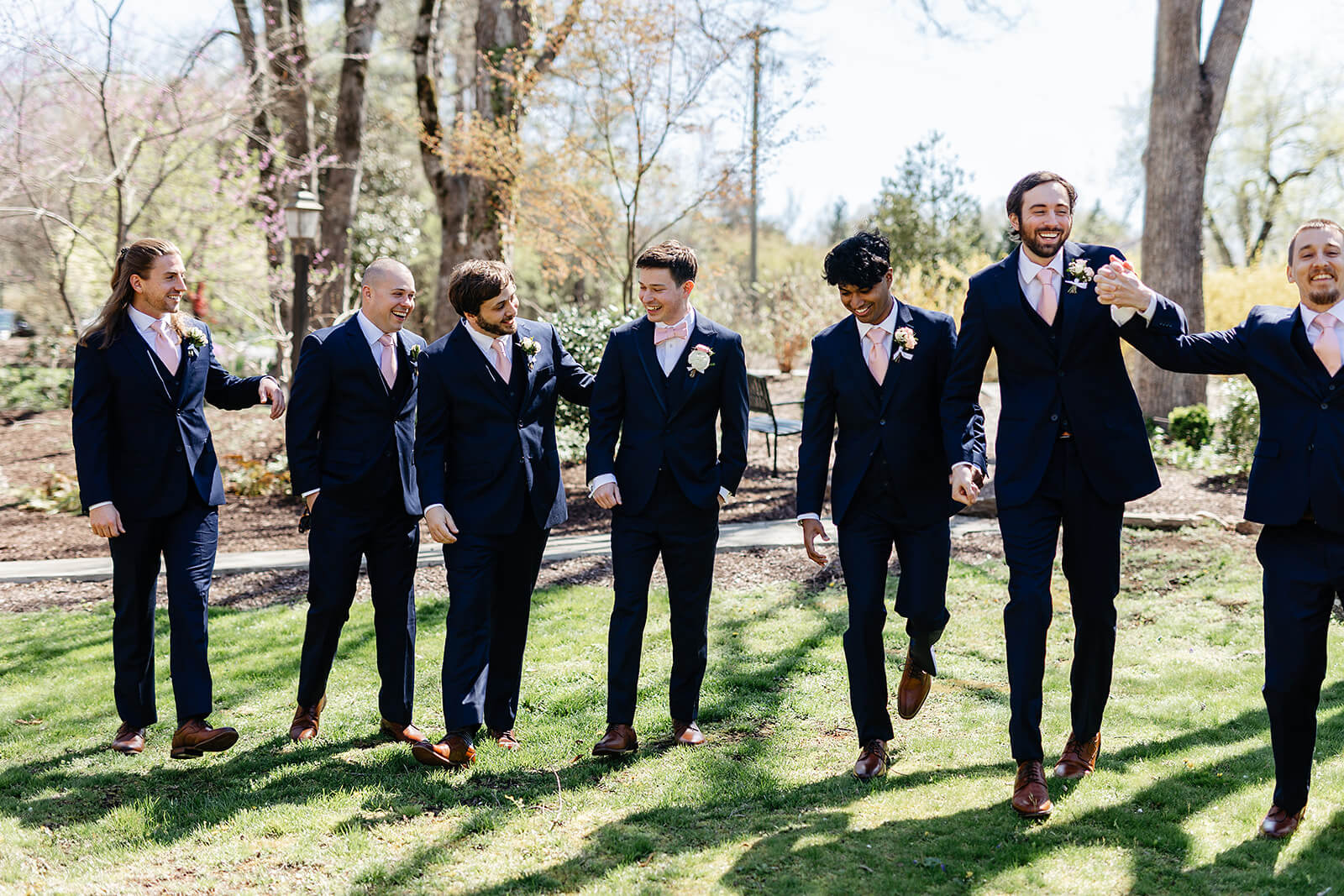 The Mill at Fine Creek Spring Wedding Photography in Powhatan 13 groom and groomsmen walking in a line outside