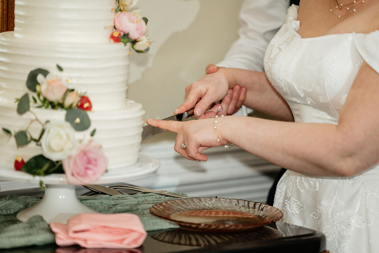 The Mill at Fine Creek Spring Wedding Photography in Powhatan 43 close up photo of bride and groom cutting wedding cake