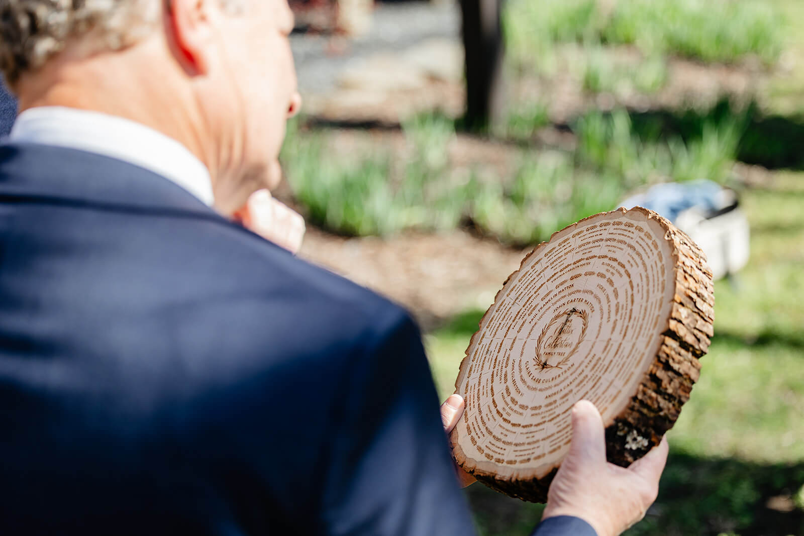The Mill at Fine Creek Spring Wedding Photography in Powhatan 22 guest admiring a wooden gift