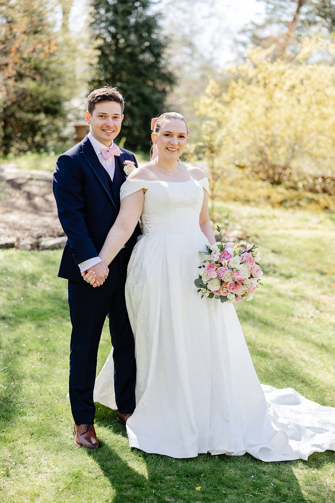 The Mill at Fine Creek Spring Wedding Photography in Powhatan 23 bride and groom standing side by side outside, holding hands