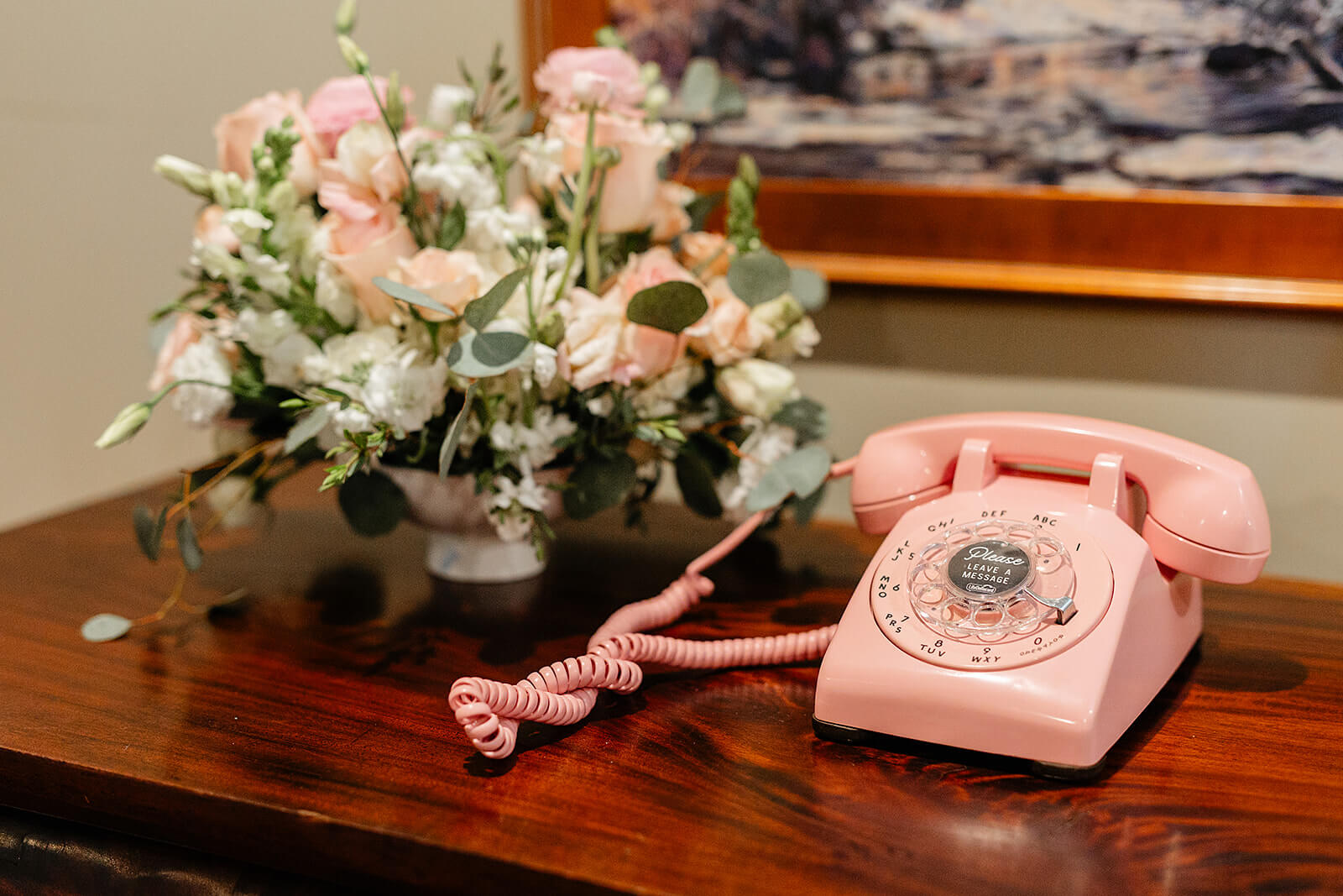 The Mill at Fine Creek Spring Wedding Photography in Powhatan 28 pink rotary phone and white, pink, and green floral arrangement