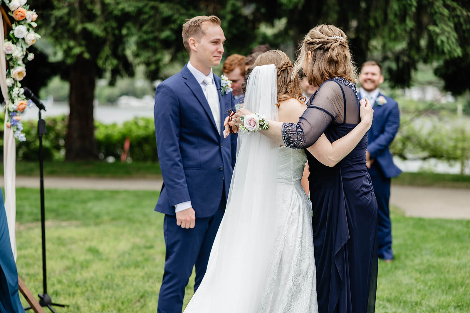 Allegheny RiverTrail Park Spring Wedding Photography 23 bride hugging groom's mom during ceremony
