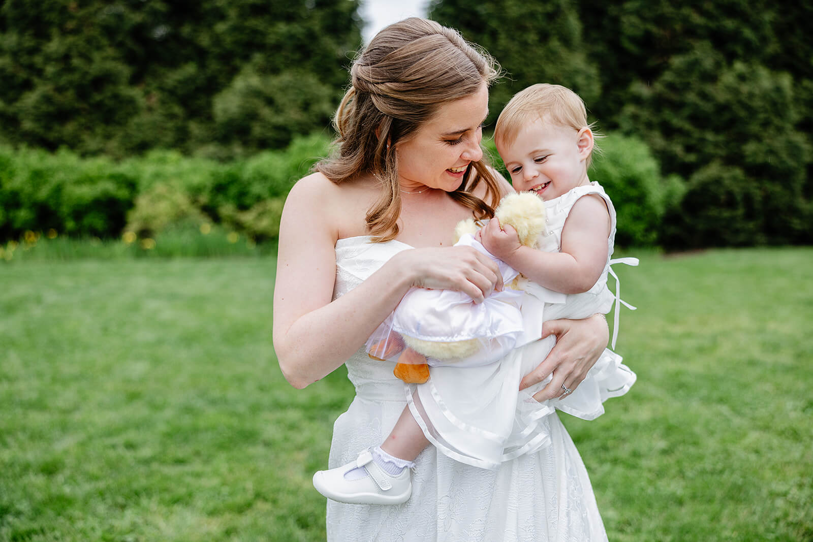 Allegheny RiverTrail Park Spring Wedding Photography 24 bride playing with flower girl