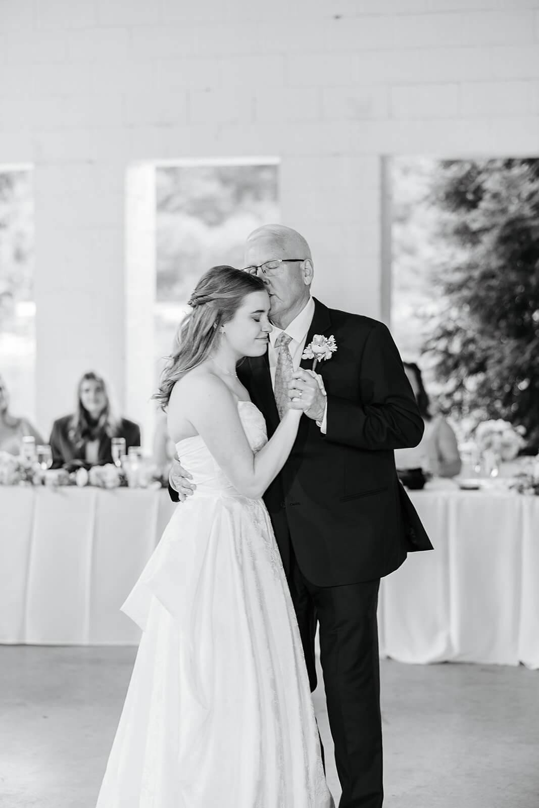 Allegheny RiverTrail Park Spring Wedding Photography 35 black and white photo of bride hugging father while they dance