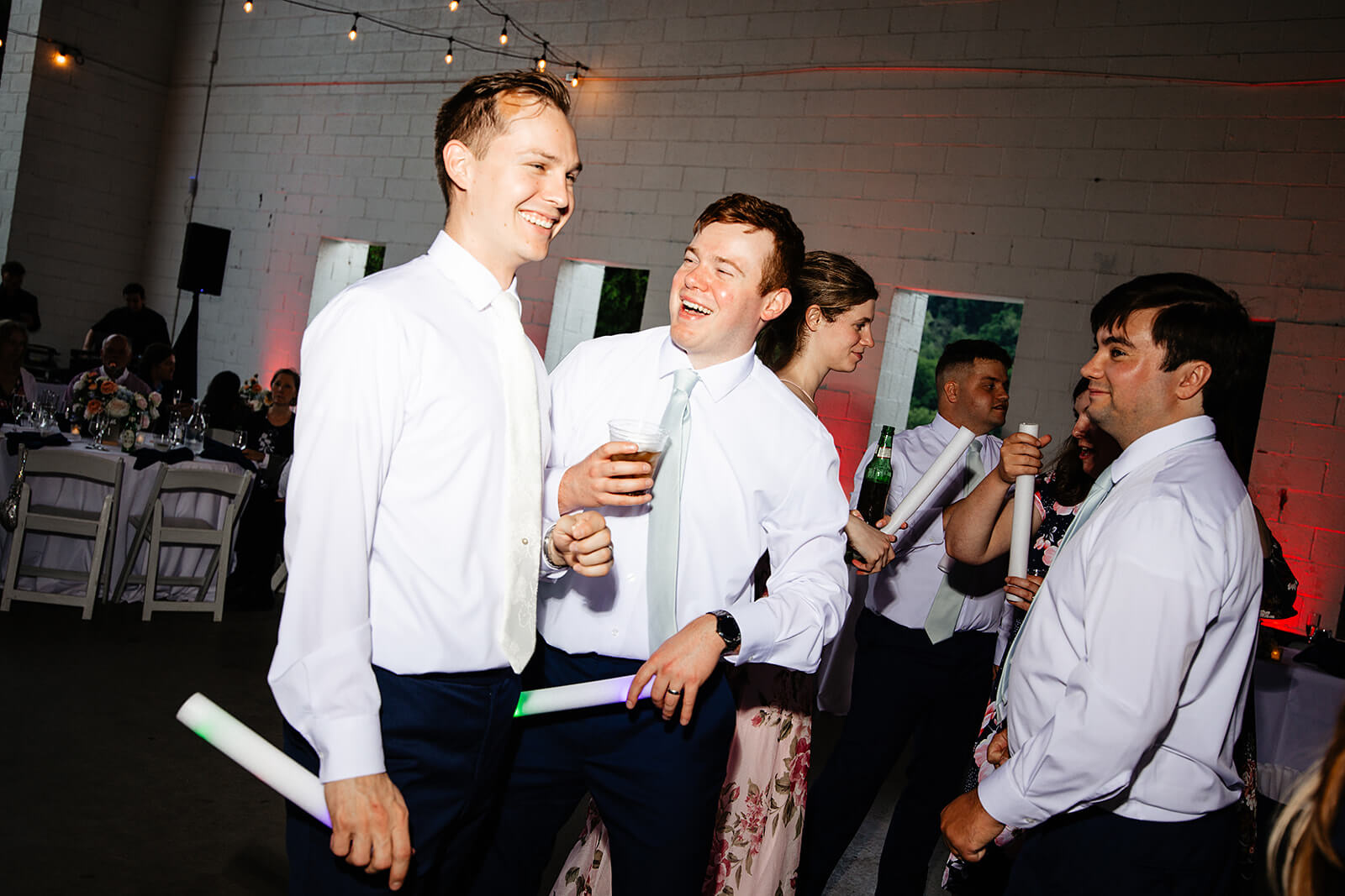 Allegheny RiverTrail Park Spring Wedding Photography 40 groom and friends smiling and talking at reception