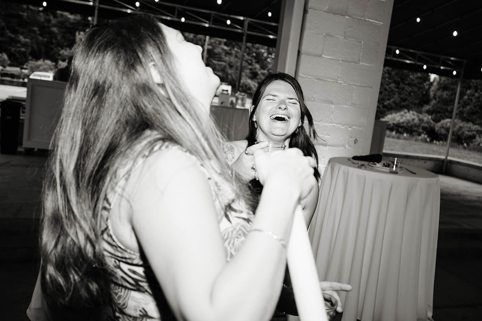 Allegheny RiverTrail Park Spring Wedding Photography 41 black and white photo of guests laughing together on the dance floor
