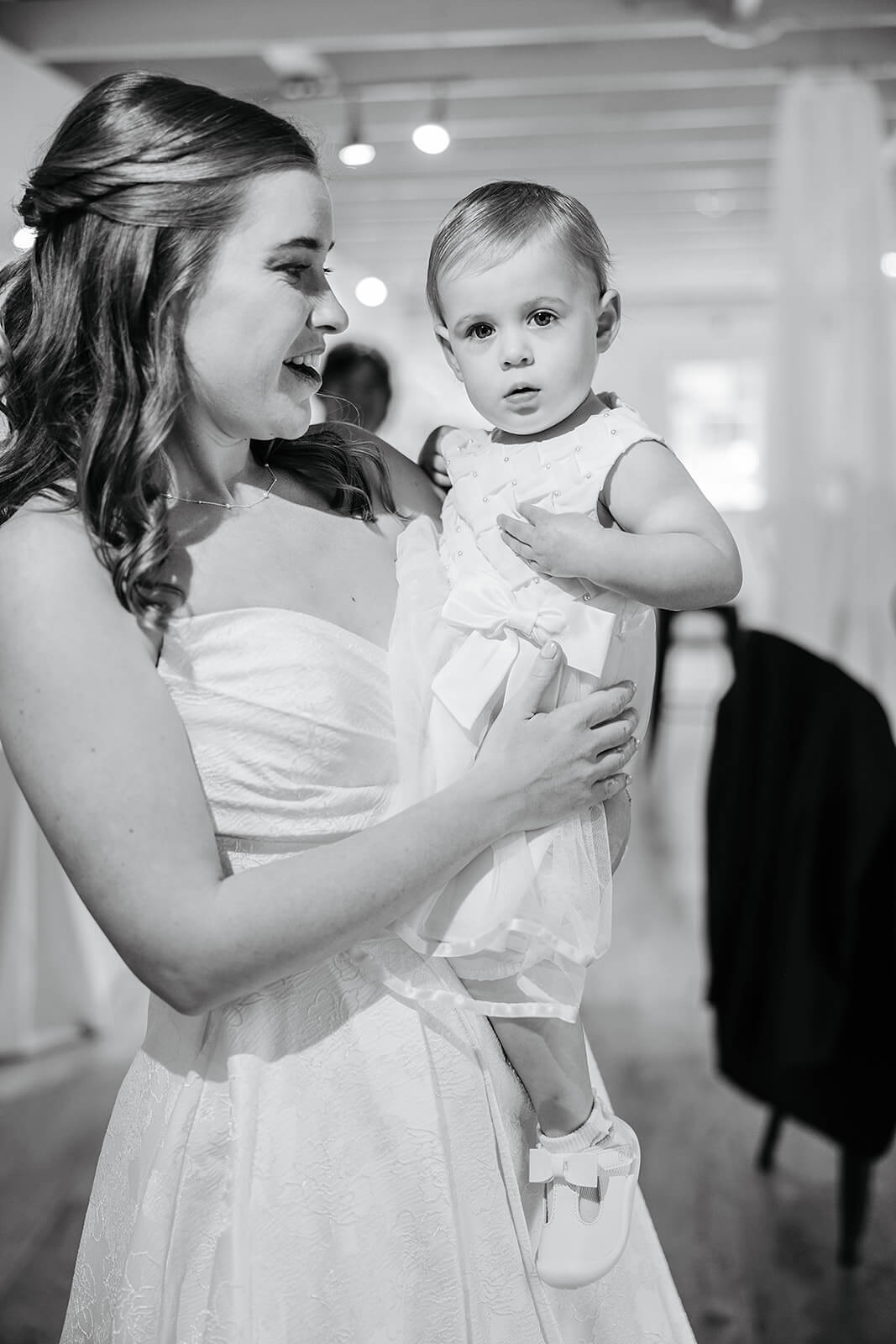 Allegheny RiverTrail Park Spring Wedding Photography 16 black and white photo of bride holding a little girl in a flower girl dress