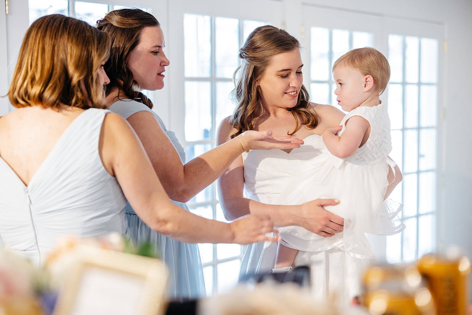 Allegheny RiverTrail Park Spring Wedding Photography 17 bride holding flower girl with bridesmaids touching her